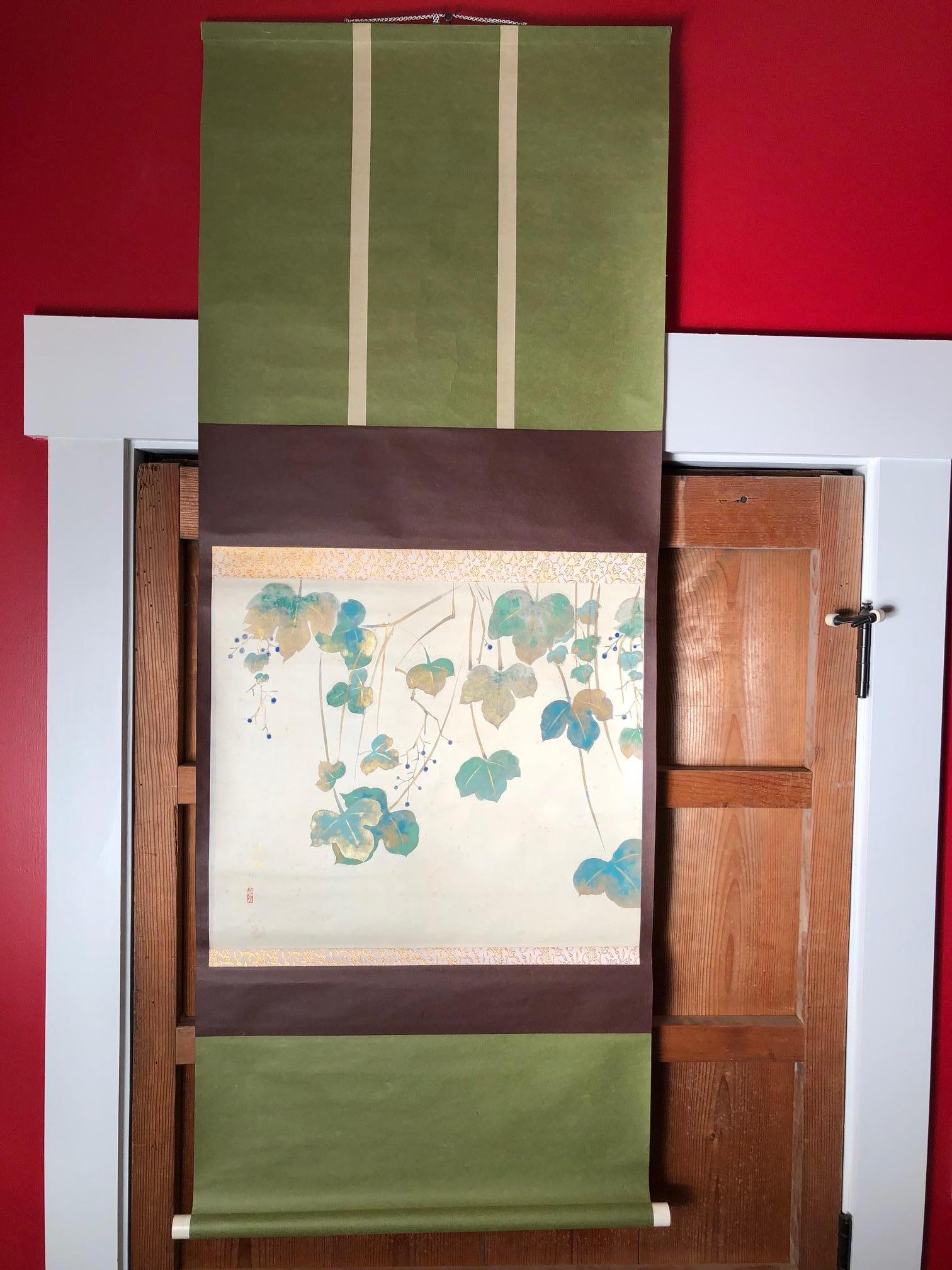 A very fine , beautiful and compelling Japanese antique hand-painted scroll of wine grapes in a garden dating to the early 20th century and worthy of your favorite room.
Hand painting on paper in lovely green, blue, and gold pleasing colors,