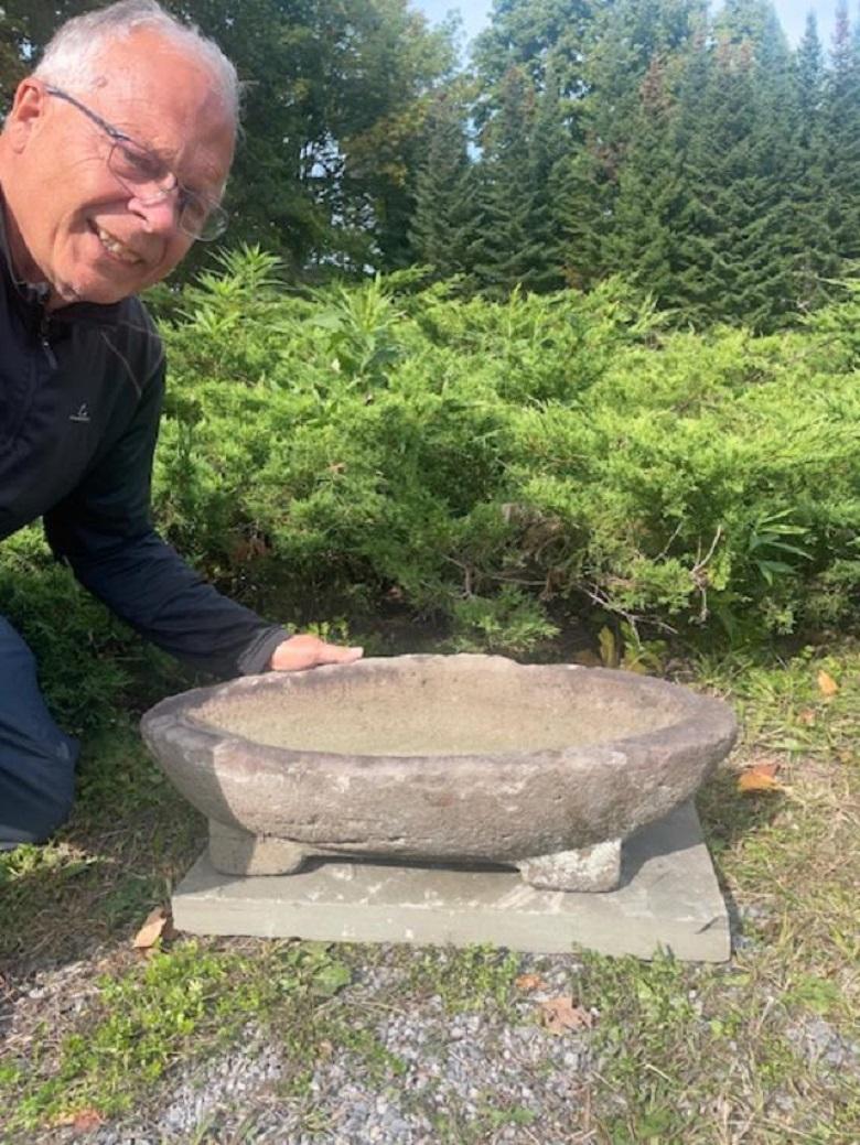 One of a Kind Find 

From our recent Japanese Acquisition Travels- comes this unusual long boat shaped garden stone vessel with a pair of elevated bottom feet -  likely repurposed from a former life as a grinding receptacle ,  as an elegant water