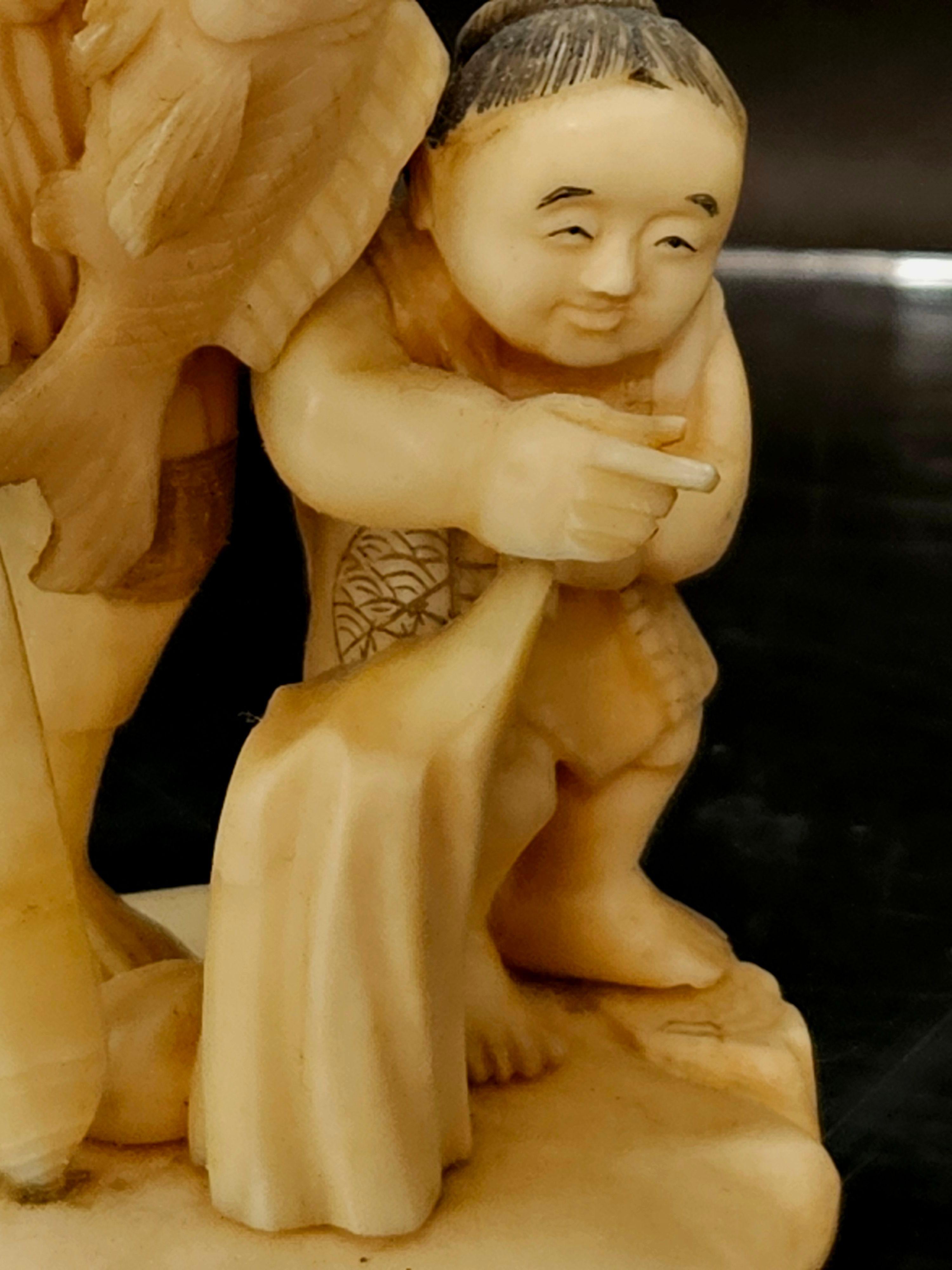 Ivory Japan Carved Okimono Group Of A Fisherman and His Kid, 1890 Meiji, Signed For Sale