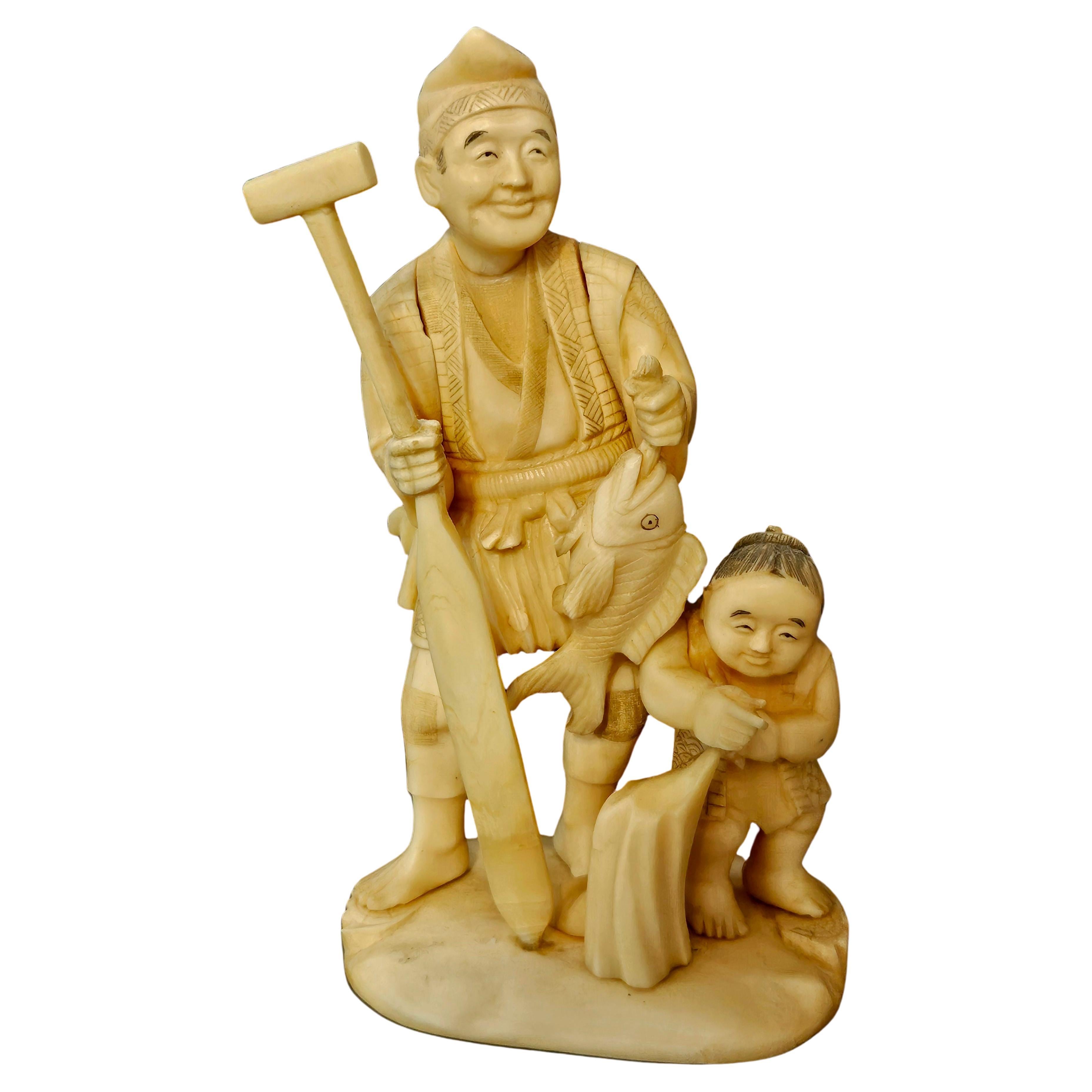 Japan Carved Okimono Group Of A Fisherman and His Kid, 1890 Meiji, Signed For Sale