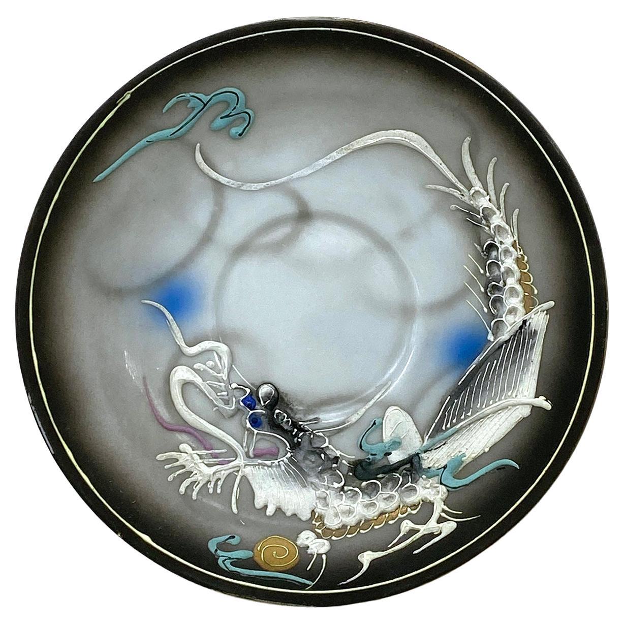 This is a set of Japan dragon moriage demi tea cup and saucer set. This egg shall procelain smoky/gray dragonwear has fired in mark Hand Painted Betson and with Made in Japan original sticker on the bottom. It can be your unique set for a collection
