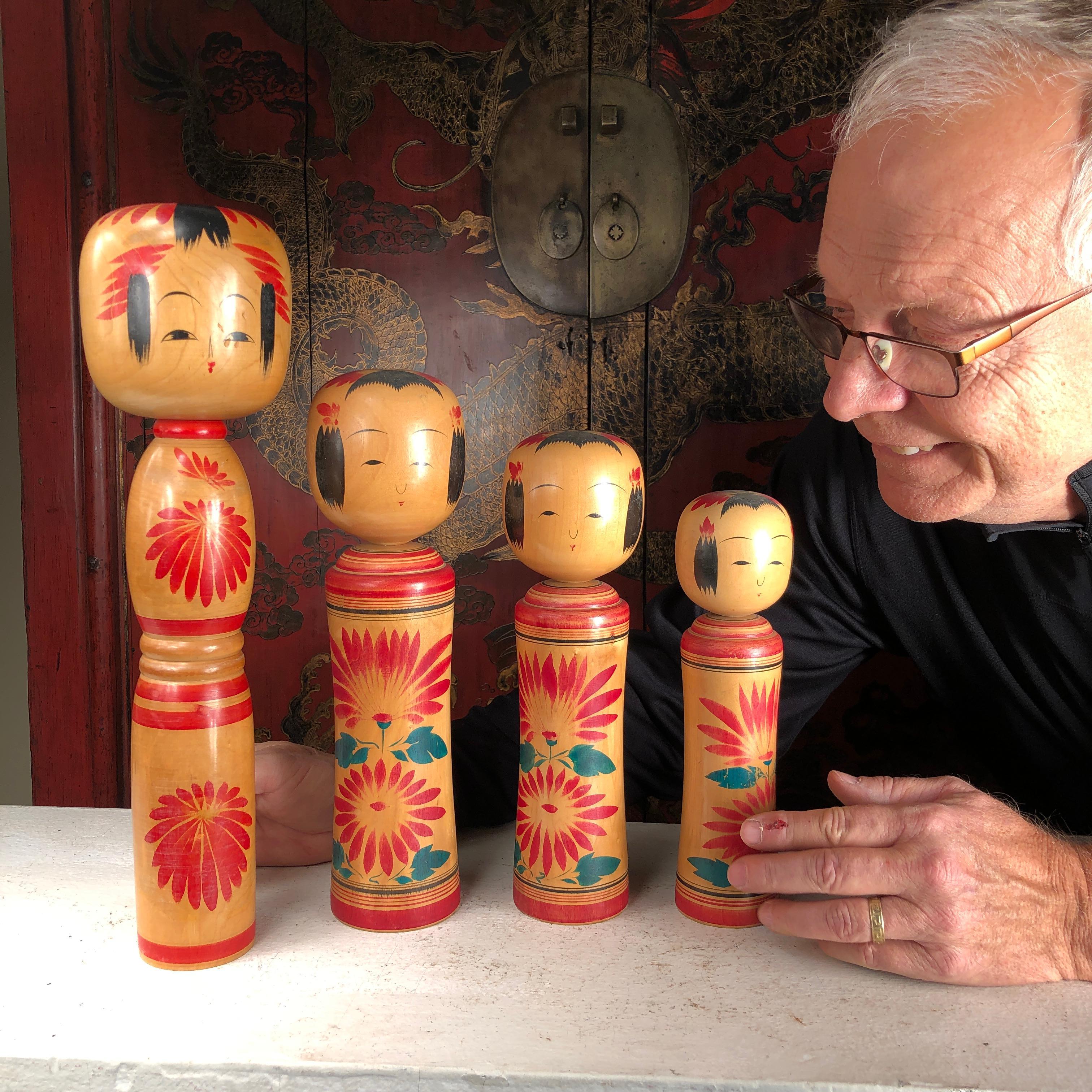 Four big hand painted and signed Kokeshi Dolls from Old Japan.

A beautifully preserved set of Japanese Folk Art hand carved and hand painted Kokeshi dolls one of Japan's most popular antique doll collectibles and unique handicraft forms. They are