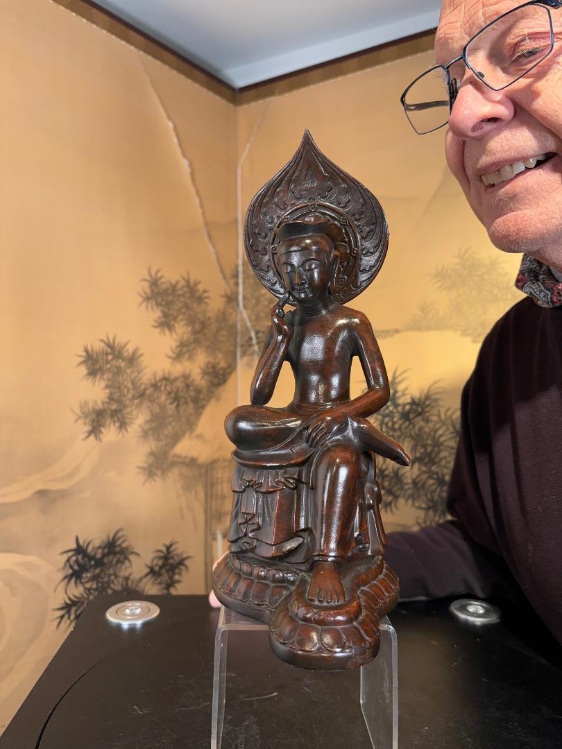 Japan, an elegant and fine seated Kanon Maitreya Guan Yin in a pensive pose, a superb work of art heavily hand cast in solid copper with a fine chocolate patina.

An ideal indoor or garden candidate.

The peaceful and youthful Kanon with a simple