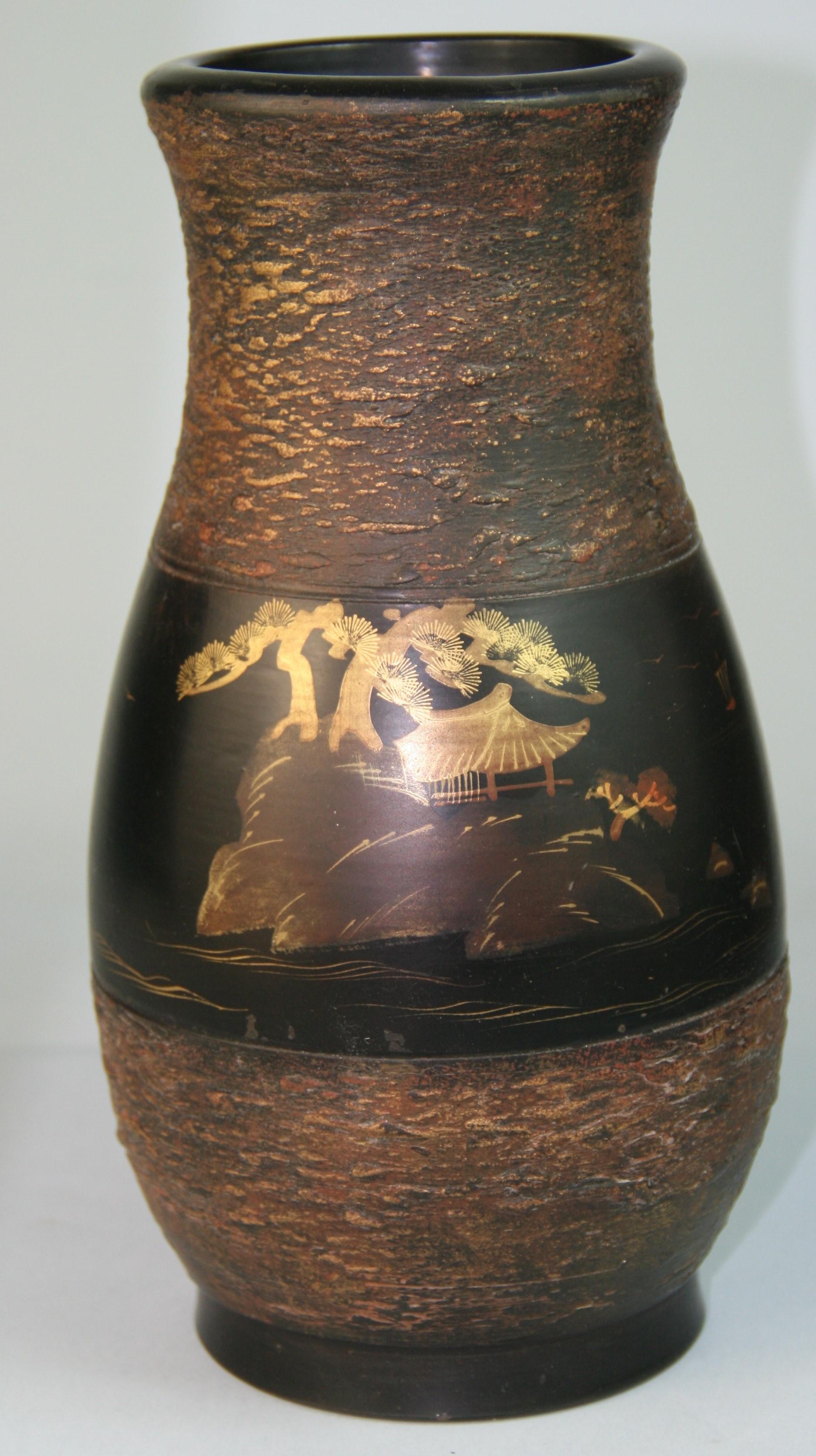1656 Japanese hand painted gilt vase with gilt trees and padodda on mountain on one side and sailing vessels on the other.
