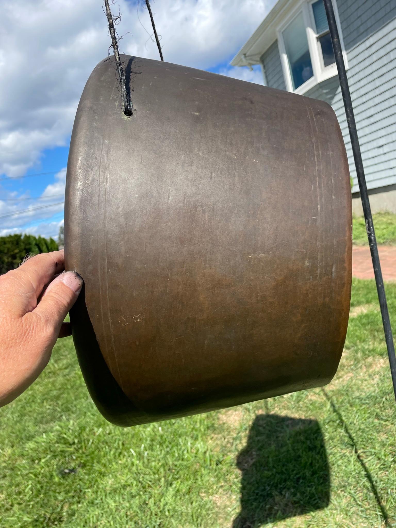 No ordinary antique gong- Impressively rare art. 

Extra oversized massively thick bronze measures 20 inches diameter and 10.5 inches thick.
Resonating sound guaranteed to please you.

Found in Japan and used by Buddhist monks, this unusual extra