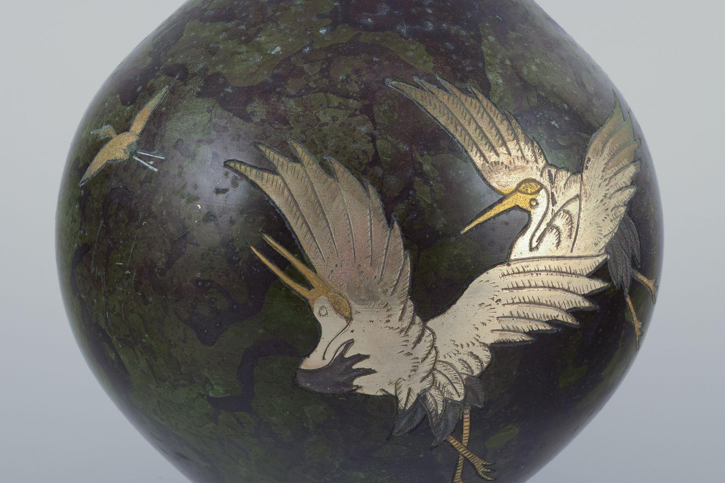 Japanese Japan, large round vase in brass. Motif of cranes in silver. Circa 1930s. For Sale
