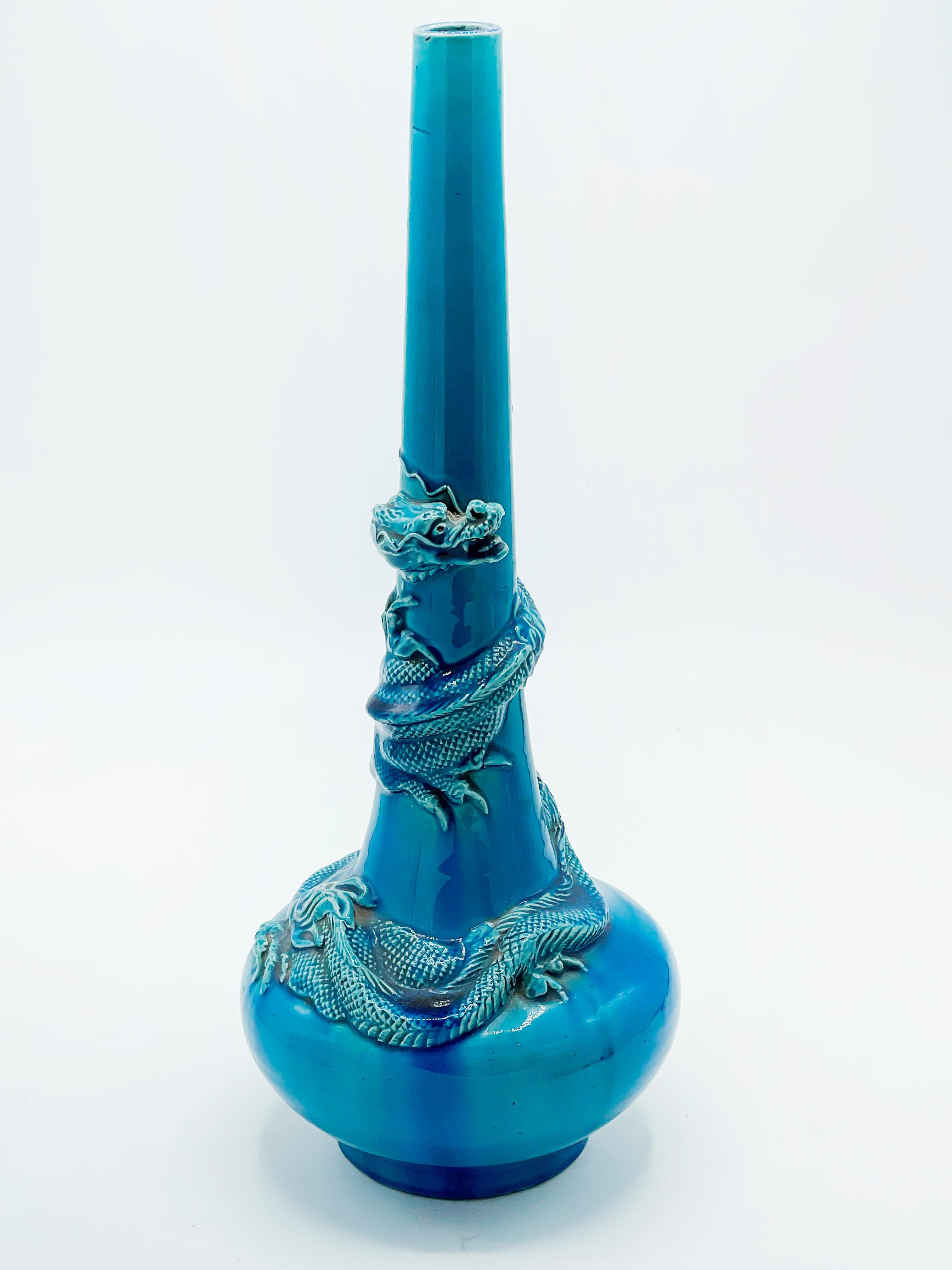 Japan, a fine robin’s egg blue -writhing dragon- porcelain vase, Awaji Kiln from the late Meiji period (1868-1912).

Dimensions: , 16” high 6” wide at base, Meiji period, (1868-1912).

The heavy porcelain vase crafted in a tubular modernist form
