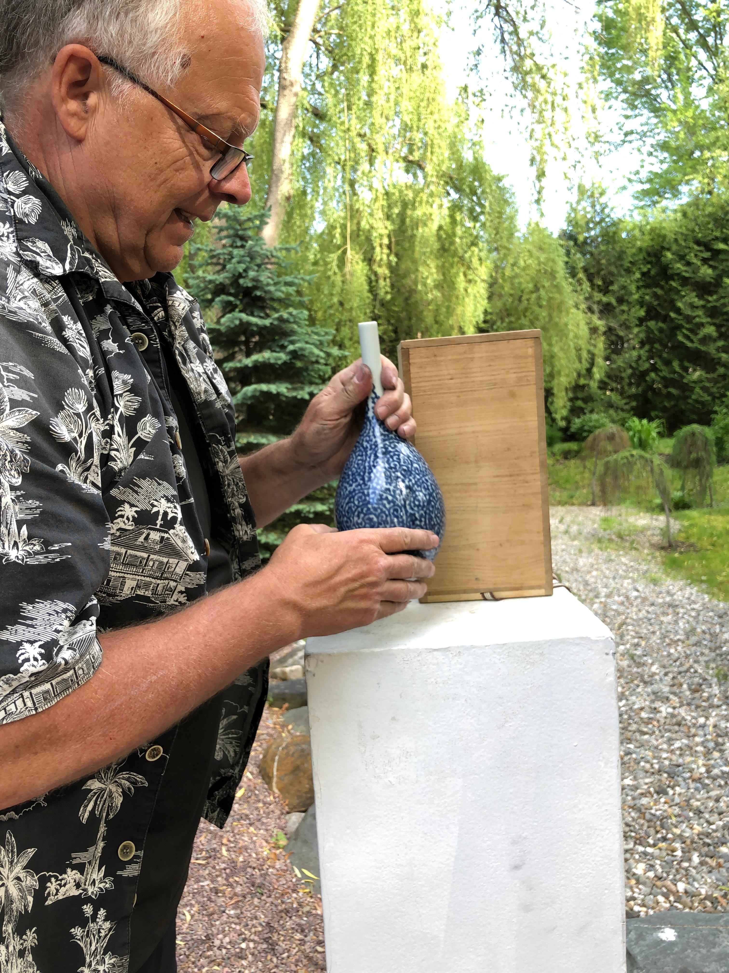 Here's a beautiful and unique way to accent your indoor space with this very unusual treasure found in Japan! 

This is a finely crafted, hand painted Arita blue and white ceramic vase hand finished in a Classic Japanese Tako Karakusa (octopus)