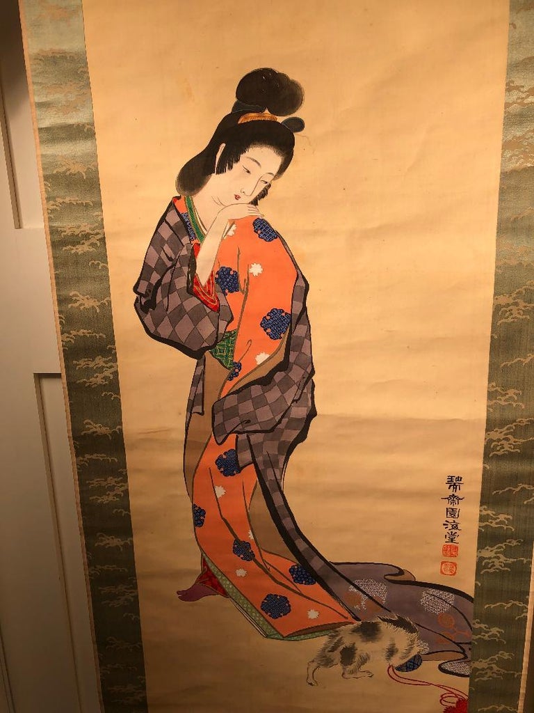 Japan, an unusual and attractive hand painting on silk scroll of a Japanese Geisha clad Kimono beauty and a cat, a work of art painted on silk.
Technique = Handpainted.
Roller Ends = Bone
Attractive subject matter. Convenient size fits small