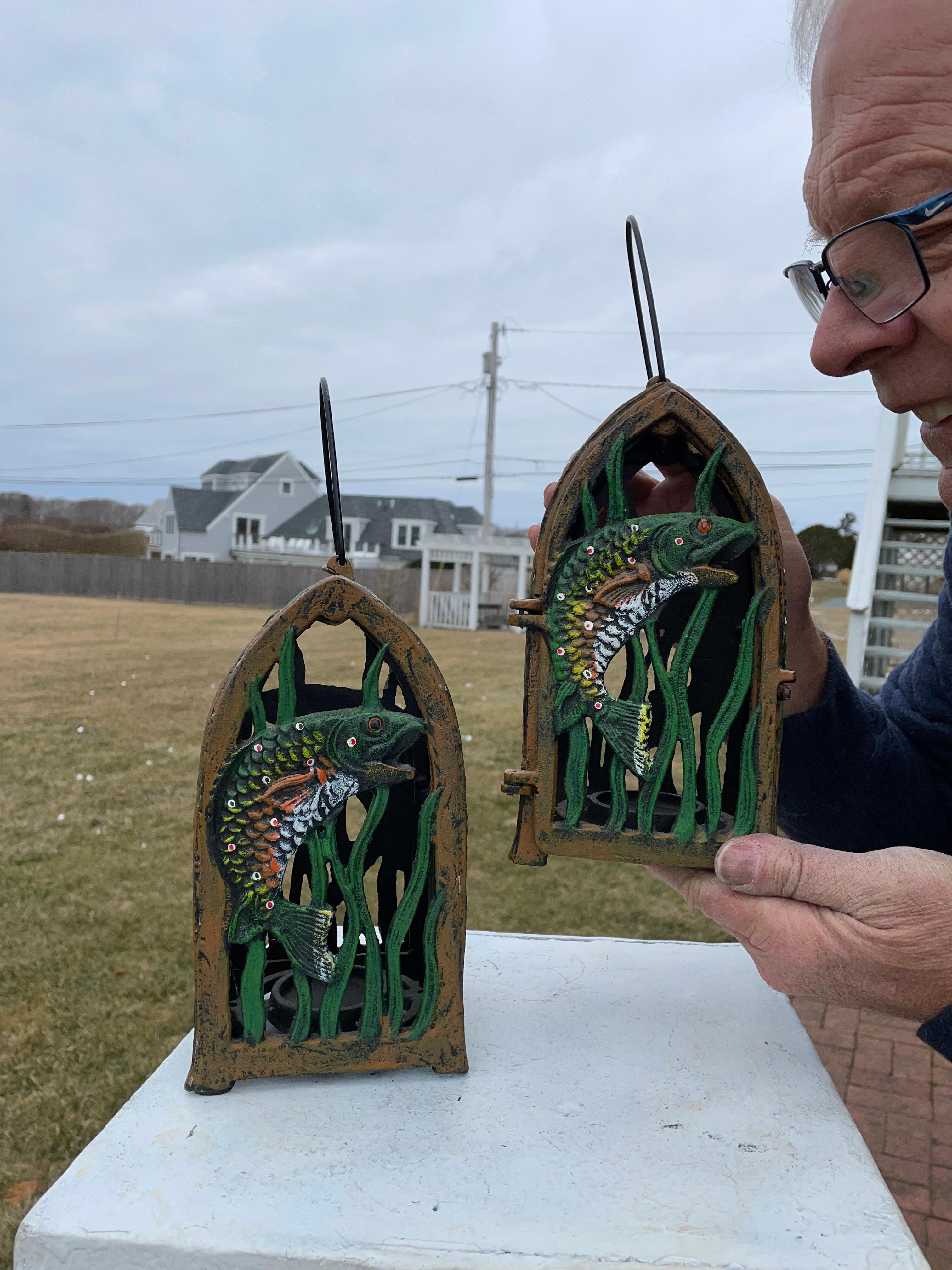 Rare Find Speckled Trout lanterns, vibrant colors 

Mint Condition

Unusual opportunity to acquire this pair (2) of Jumping Speckled Trout themed hand painted iron garden lanterns- the finest quality pair of this design we have seen.