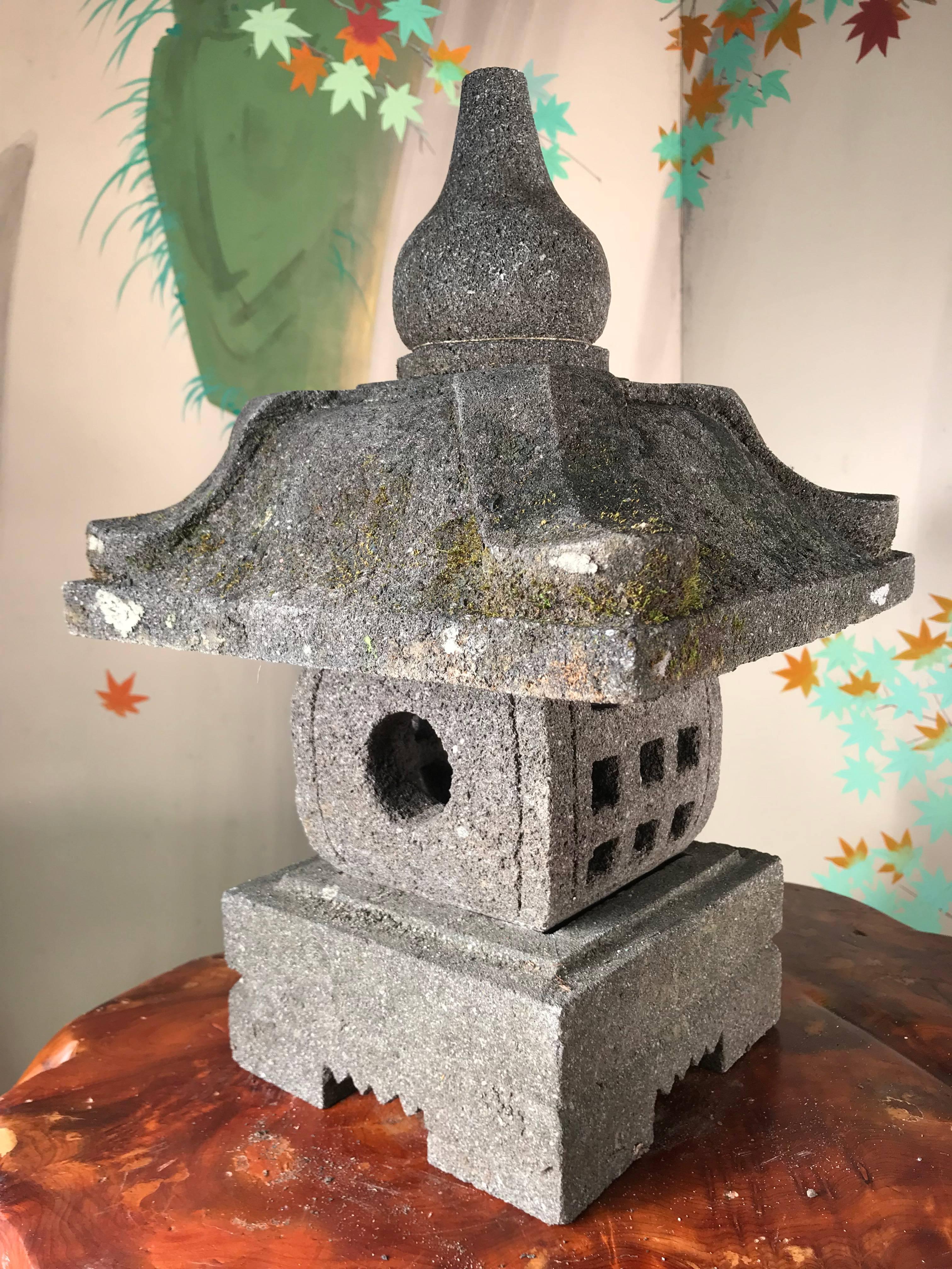 Japan a handsome modest sized stone Pagoda top -Yukimi-lantern ideally suited for a small tea garden out of doors or inside in your favorite sun space. 

The striking and well proportioned stone lantern is fashioned in four parts for easy