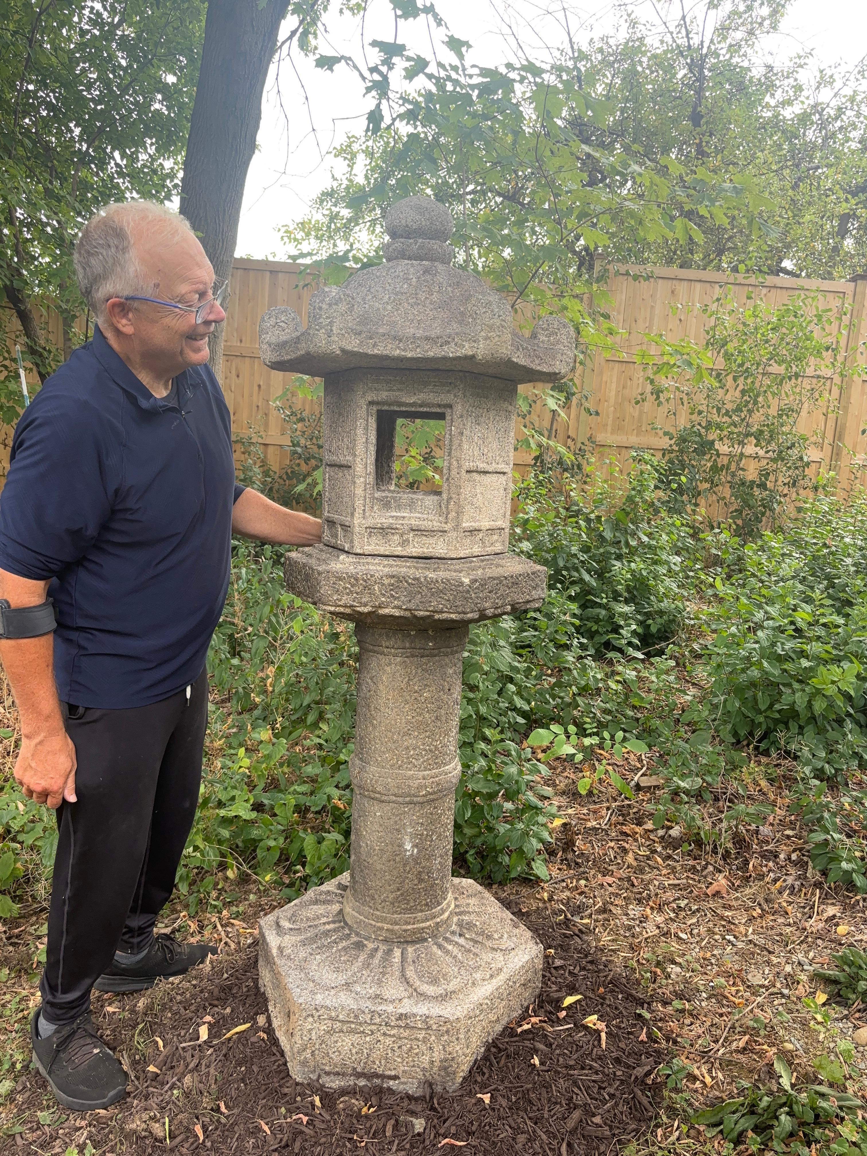 An early antique beauty with all original pieces.

Please view our video.

Japan, a tall and stone lantern with fence like engraved designs on its firebox , carefully crafted in six pieces for ease of portability.

Dimensions: 68 inches tall and 24