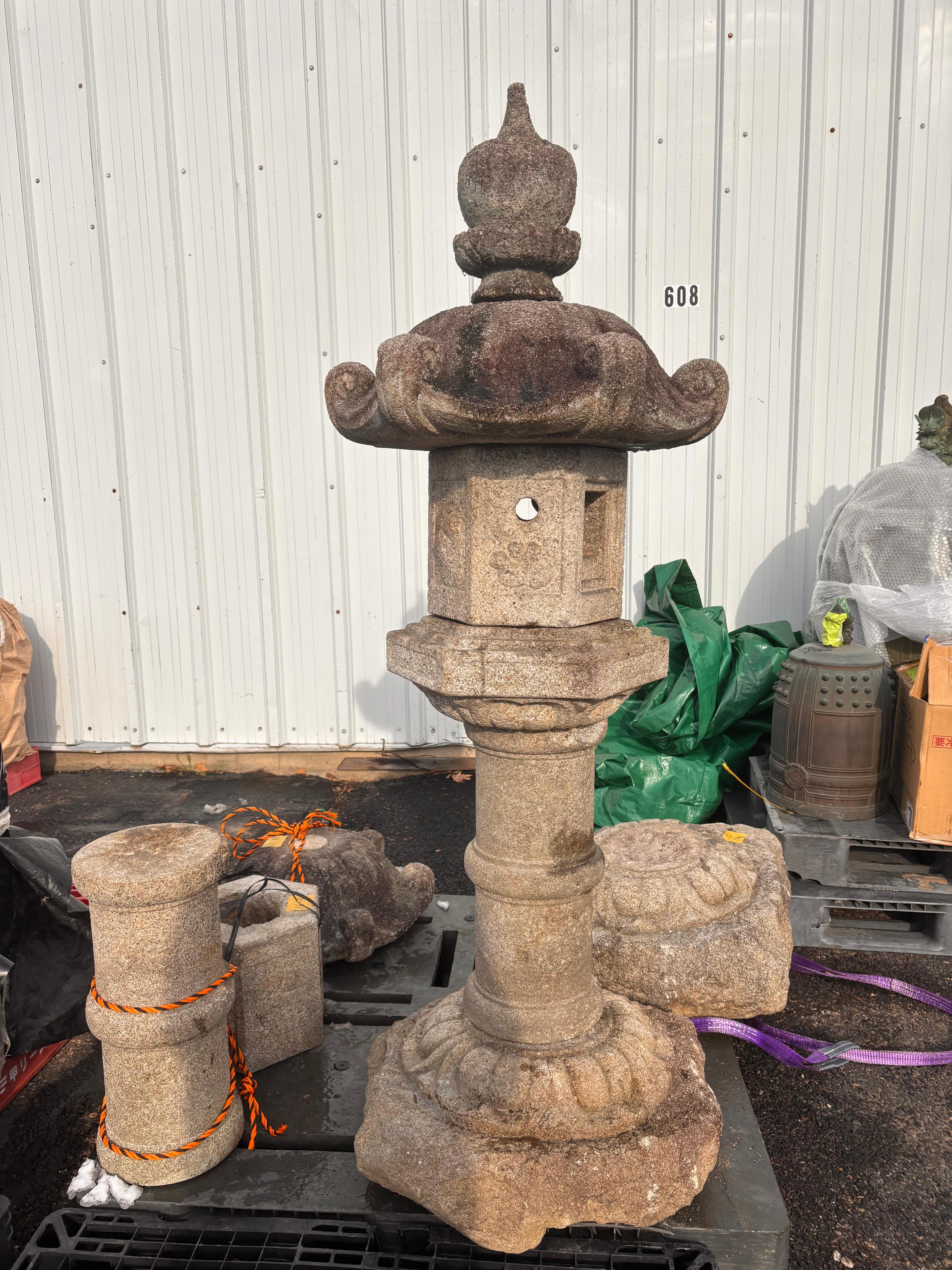 An antique beauty with all original pieces.

Japan, a tall and stone lantern with engraved designs, carefully crafted in six pieces for ease of portability.

Dimensions: 65 inches tall and 18 inches diameter, six pieces

Quality: original dark