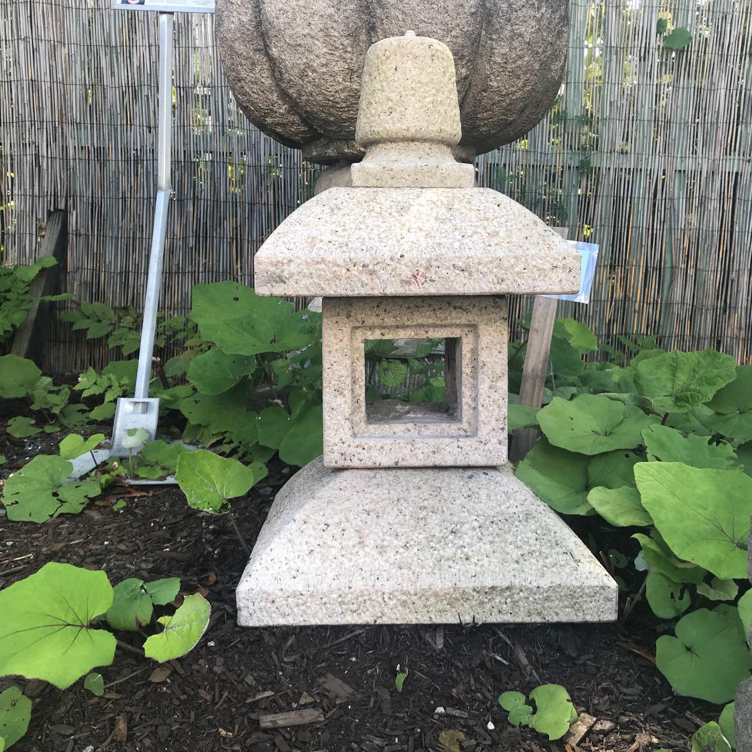 Japan, a fine easily portable hand-carved granite stone tea lantern with square roof measures 24 inches high and 13 inches wide, Showa period 1940s-1950s. 

Carved from solid granite by Japanese specialized artisans over 50 years ago. This is a