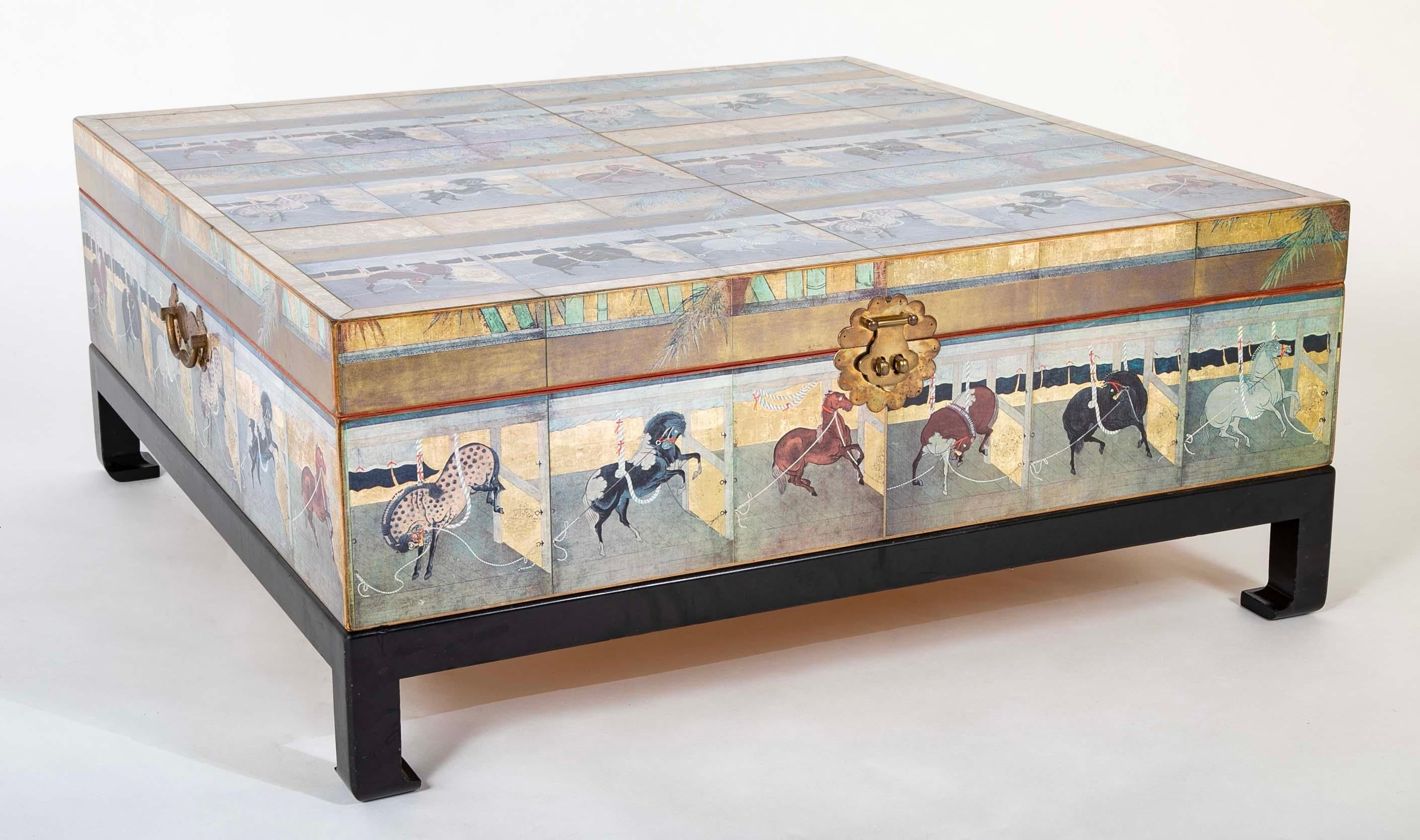 Japanese style equestrian themed lacquered square coffee table with a lift top that opens to a large storage area. The top and sides decorated with decoupage equestrian scenes of individual horses being trained, copied from an 18th century Japanese