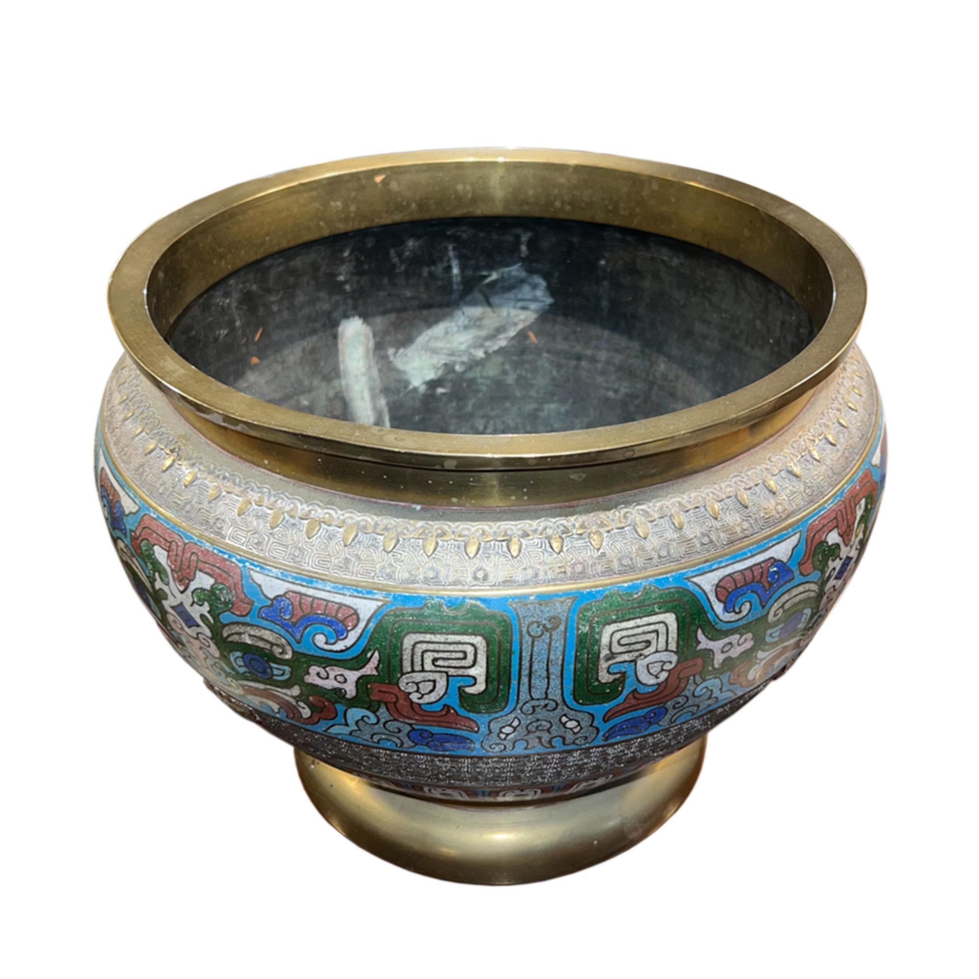 This is a very decorative jardiniere, made in Japan in the 1920s. 

We would recommend this is used for indoor plants and not placed outside - a great unique gift!

Made from enamel and brass with a lovely multi coloured design.