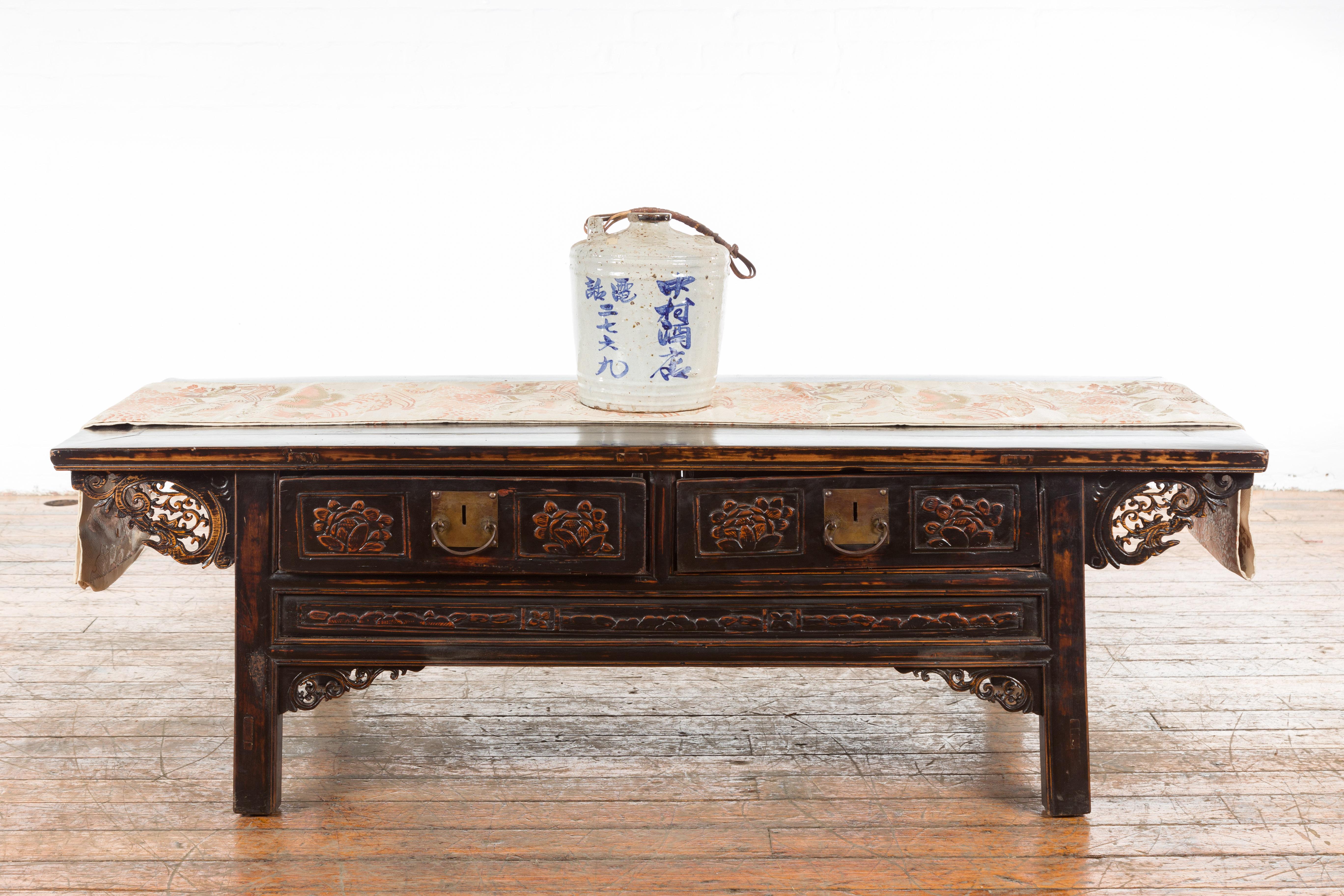 A Japanese antique jug from the 19th century, with blue calligraphy and rattan handle. Created in Japan during the 19th century, this ceramic jug features a circular body with white blotched ground, showcasing a small opening of 2.25