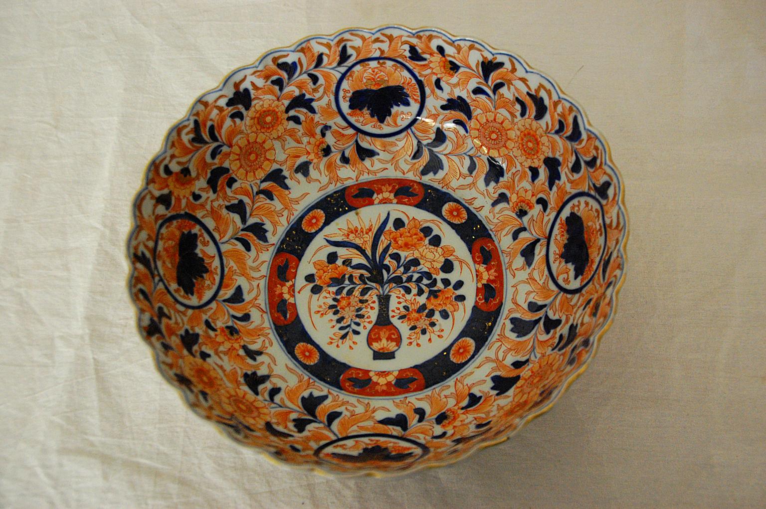 Japanese 19th century Imari 11 inch fluted bowl by the maker Koransha. This impressive bowl is marked with Koransha's blue mountain mark and exemplifies the fine quality of Koransha's potters and painters. It is painted in underglaze blue and