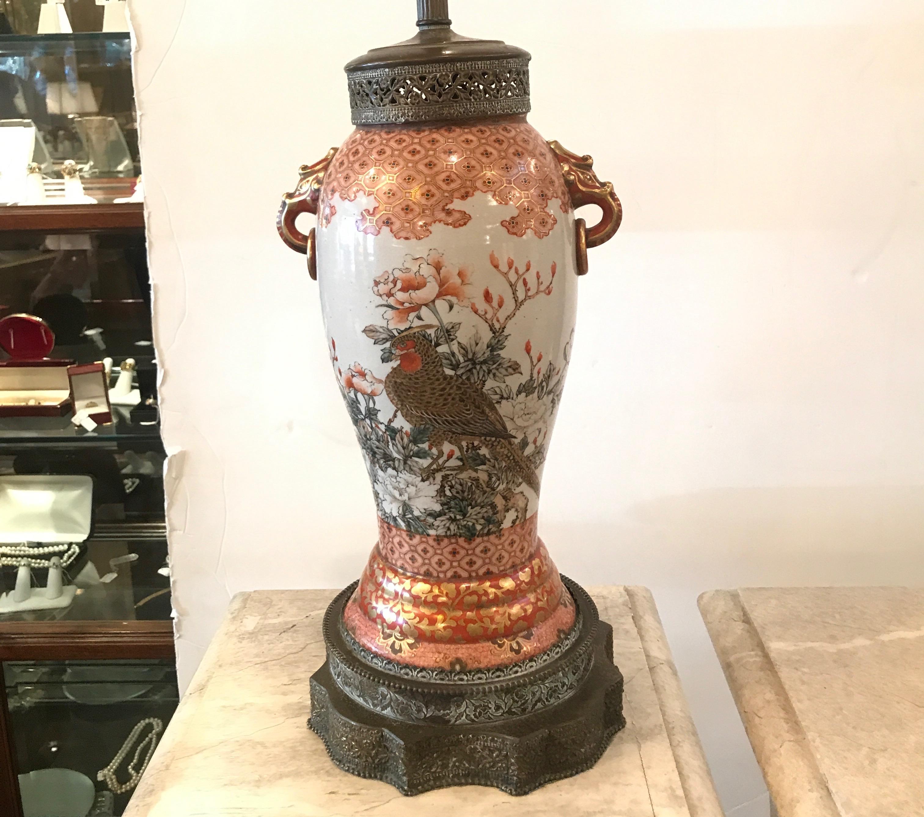Beautifully hand painted Japanese Kutani vase, circa 1880 now as a lamp. The brass mounts show this was lamped in the early part of the 20th century, circa 1920 . The brass mounts showing age patination. The top of the lamp with a shade is 34
