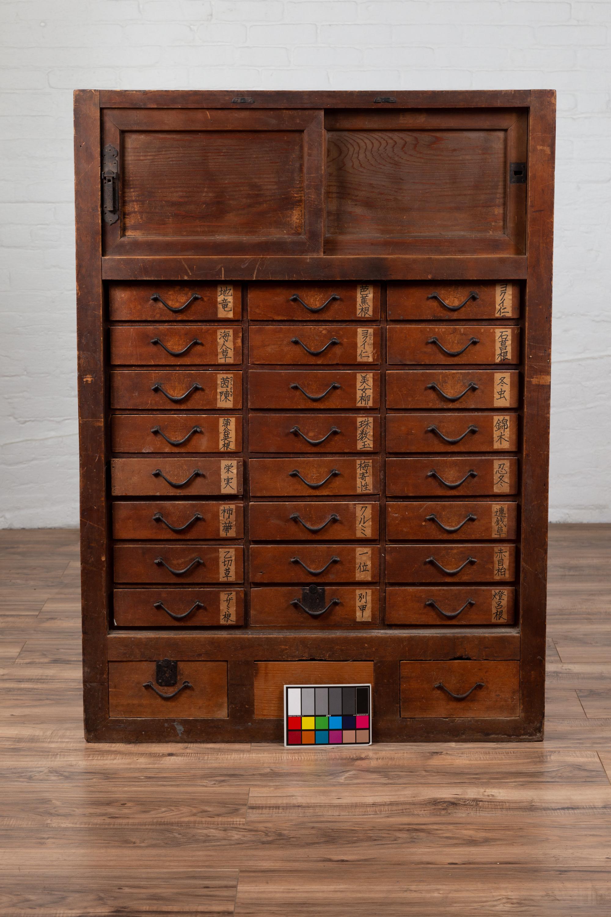 Japanese 19th Century Meiji Period Apothecary Cabinet with 27 Drawers and Doors 9