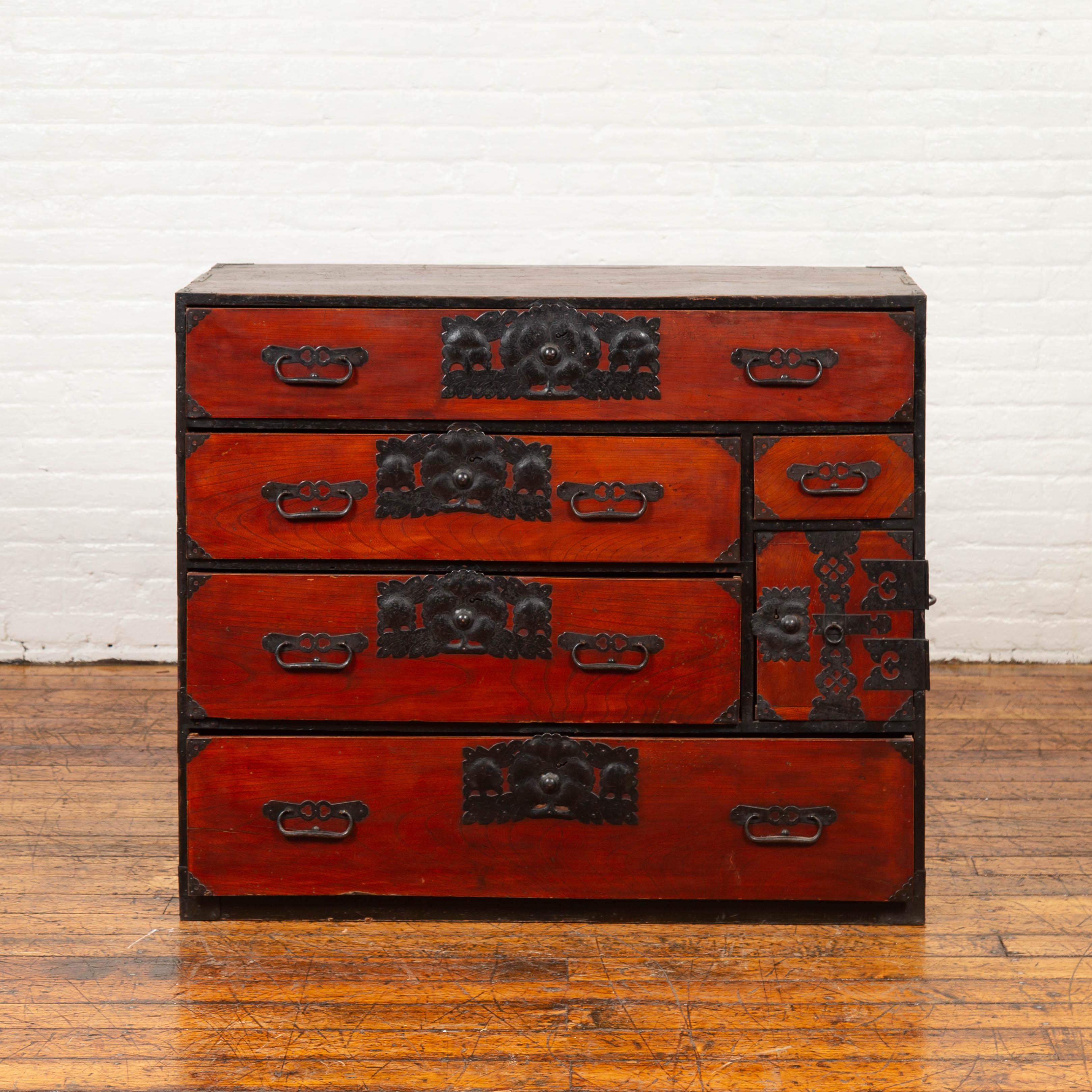 A Japanese 19th century Sendai tansu (Isho-dansu) clothing cabinet with drawers and elaborate bronze hardware. Born in Japan during the 19th century, this wooden Tansu chest is a fine example of Japan's traditional cabinetry. Featuring a lovely