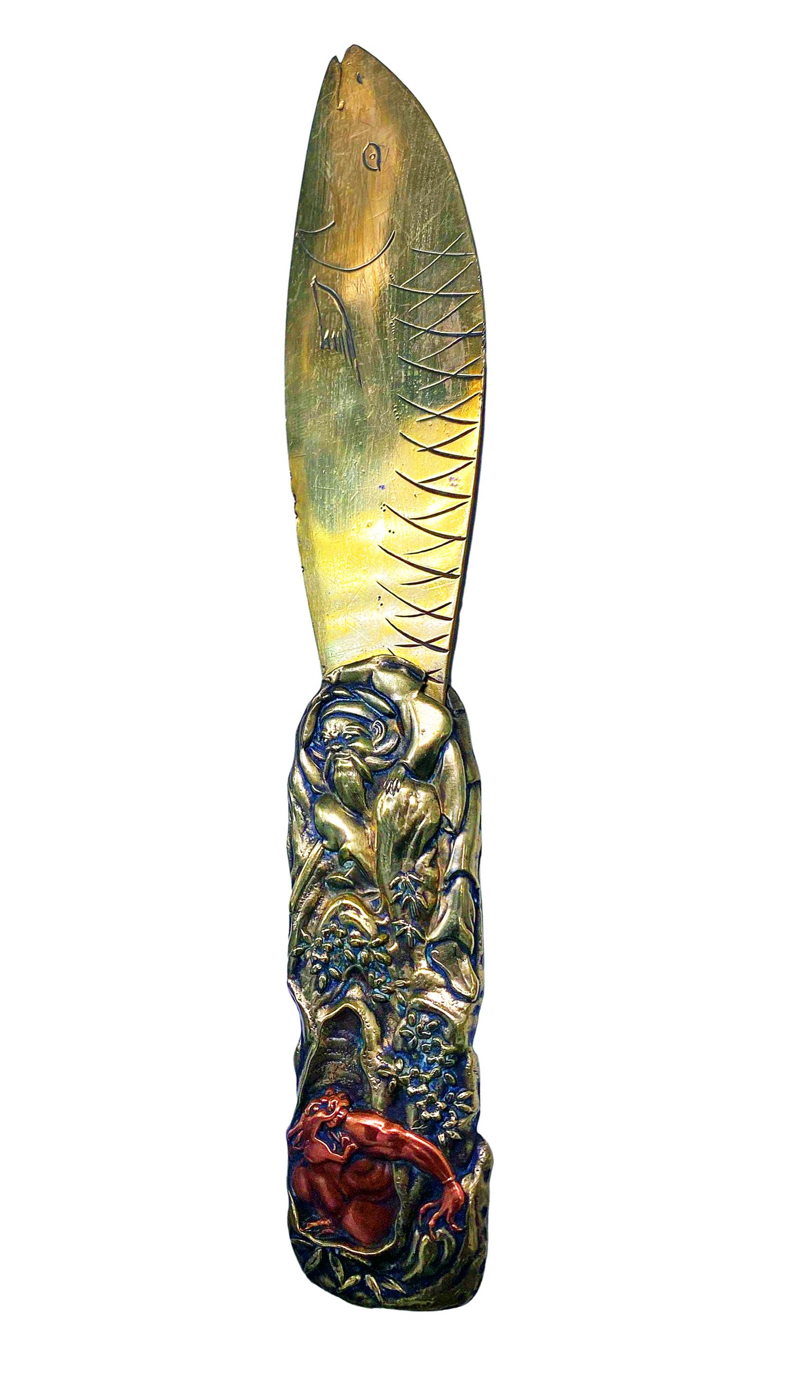 Japanese 19th century mixed metals, letter opener C.1880. The letter opener brass and copper mixed metals, blade in the form of a fish, the front handle depicting mythological figures, the reverse with chrysanthemums plant. Length: - 8.6 inches.