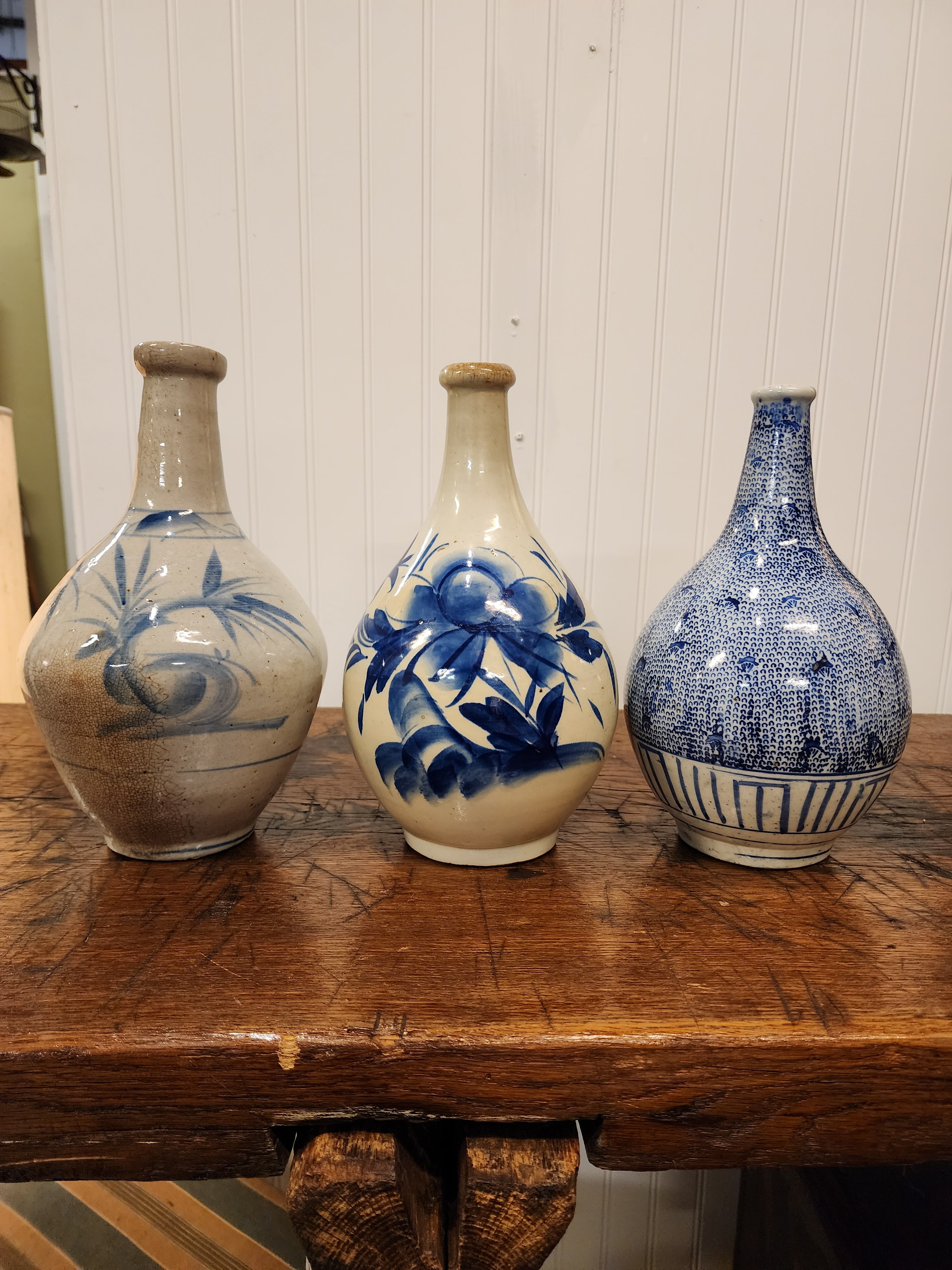 A lovely set of three Japanese mid 19th century sake bottles, circa 1840-50's, each with distinctive decoration and construction.
These can be used as lamps, vases, or even for decanters.
Purchased as a collection from an estate in Yarmouth Port