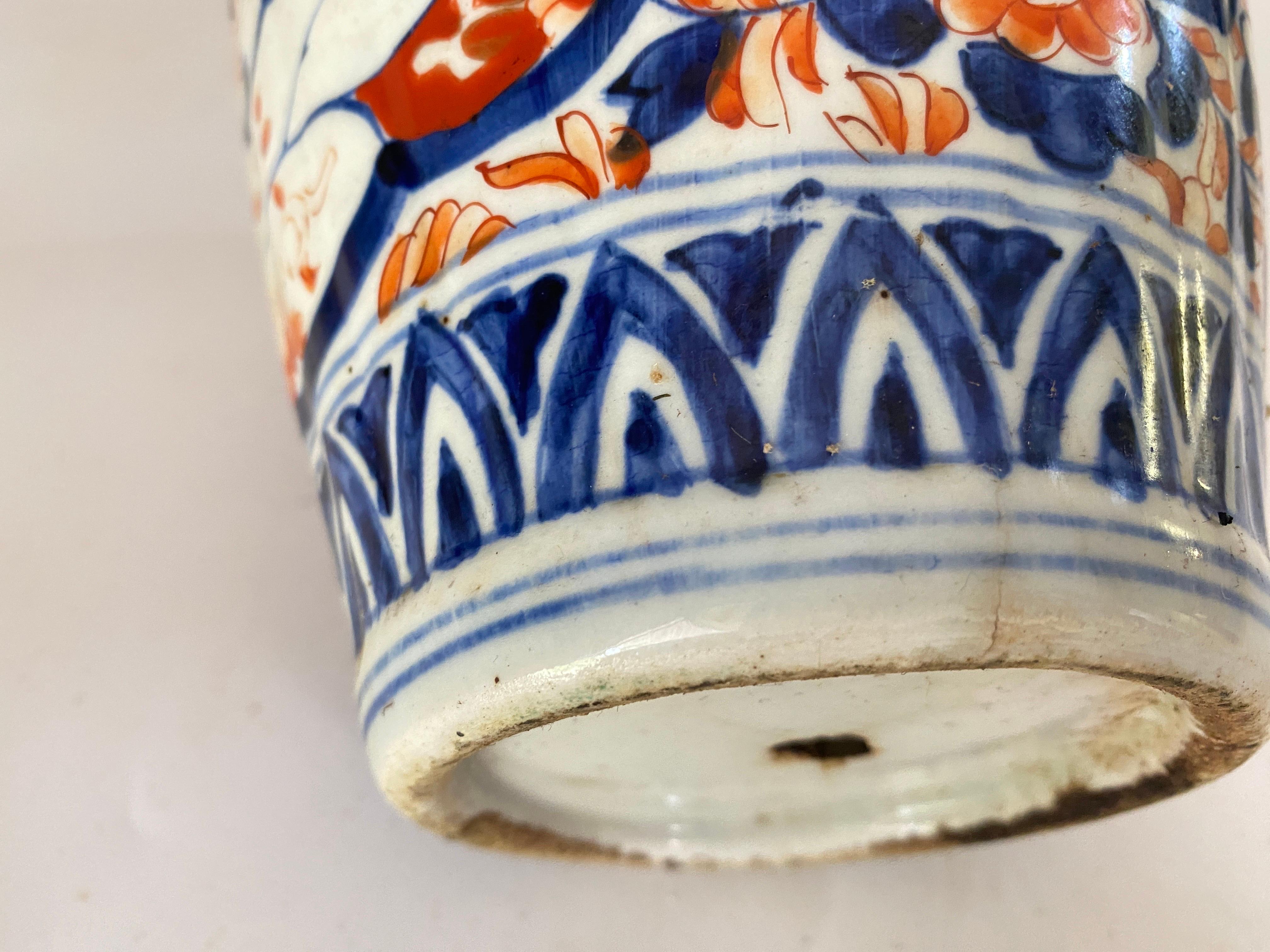 Japanese Vase, made in Japan at the beginning of the 19th century. Mejii Period With beautiful colors in red blue and white. The vase is in good condition.