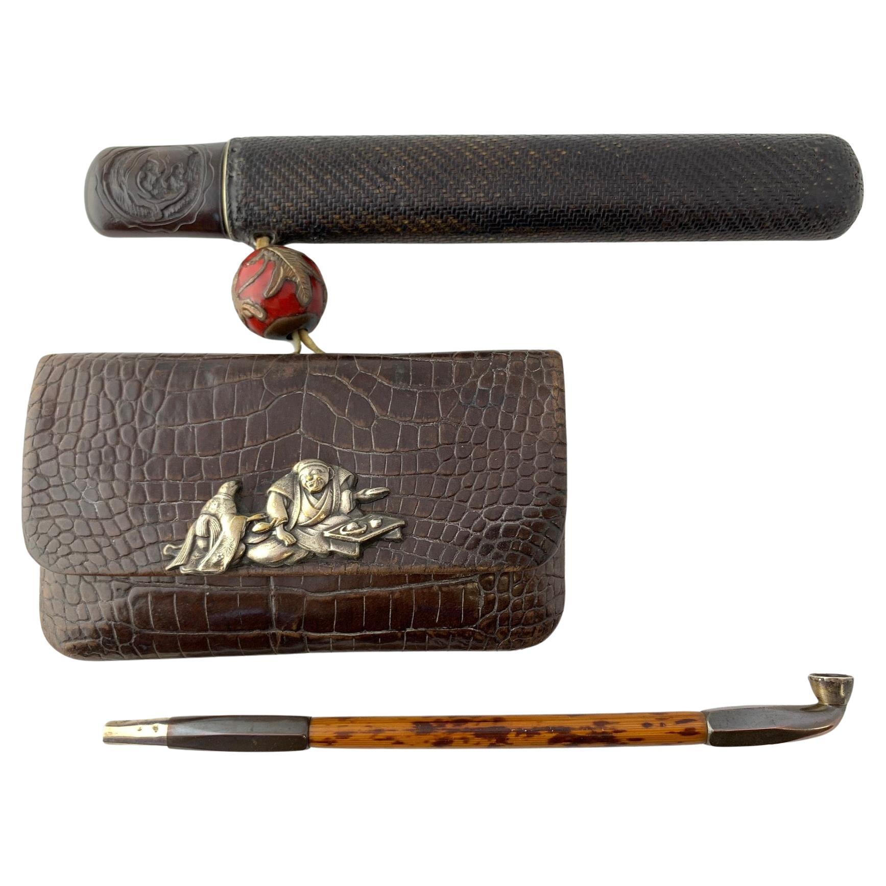 Japanese 19th Century Tabako Ire Leather Pouch with Pipe, Silver Menuki, Ojime For Sale