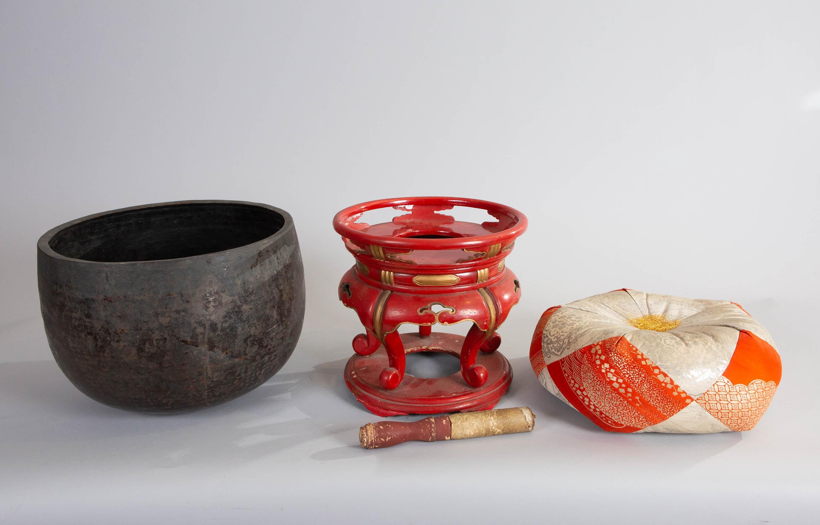 Japanese 19th century temple gong. Temple gongs were originally used to beckon the gods. Comes with bronze bell, silk pillow, red lacquer stand and striker with wear consistent with age and use. When struck, the bell produces a wonderful, long