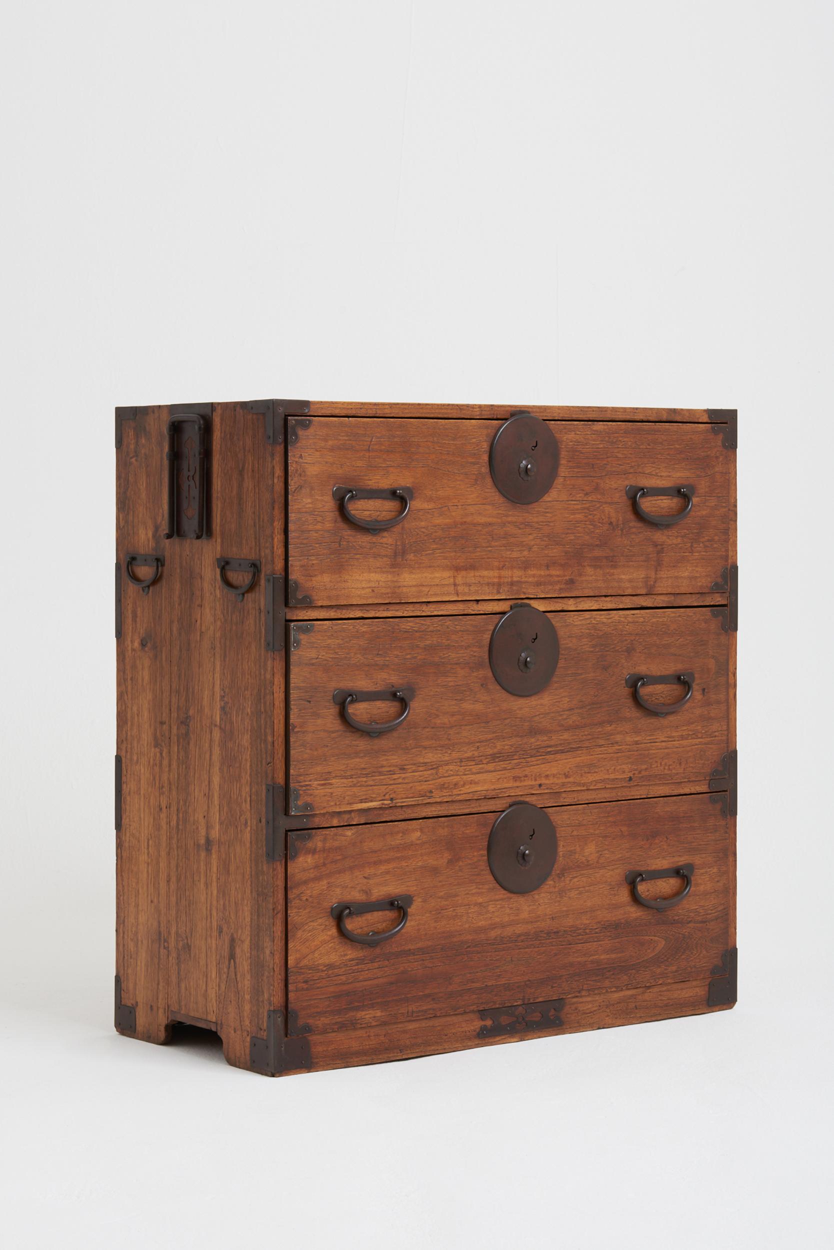 A Meiji period Kirinoki wood and forged iron 'Ko Tansu' chest of drawers. 
Japan, Circa 1880.