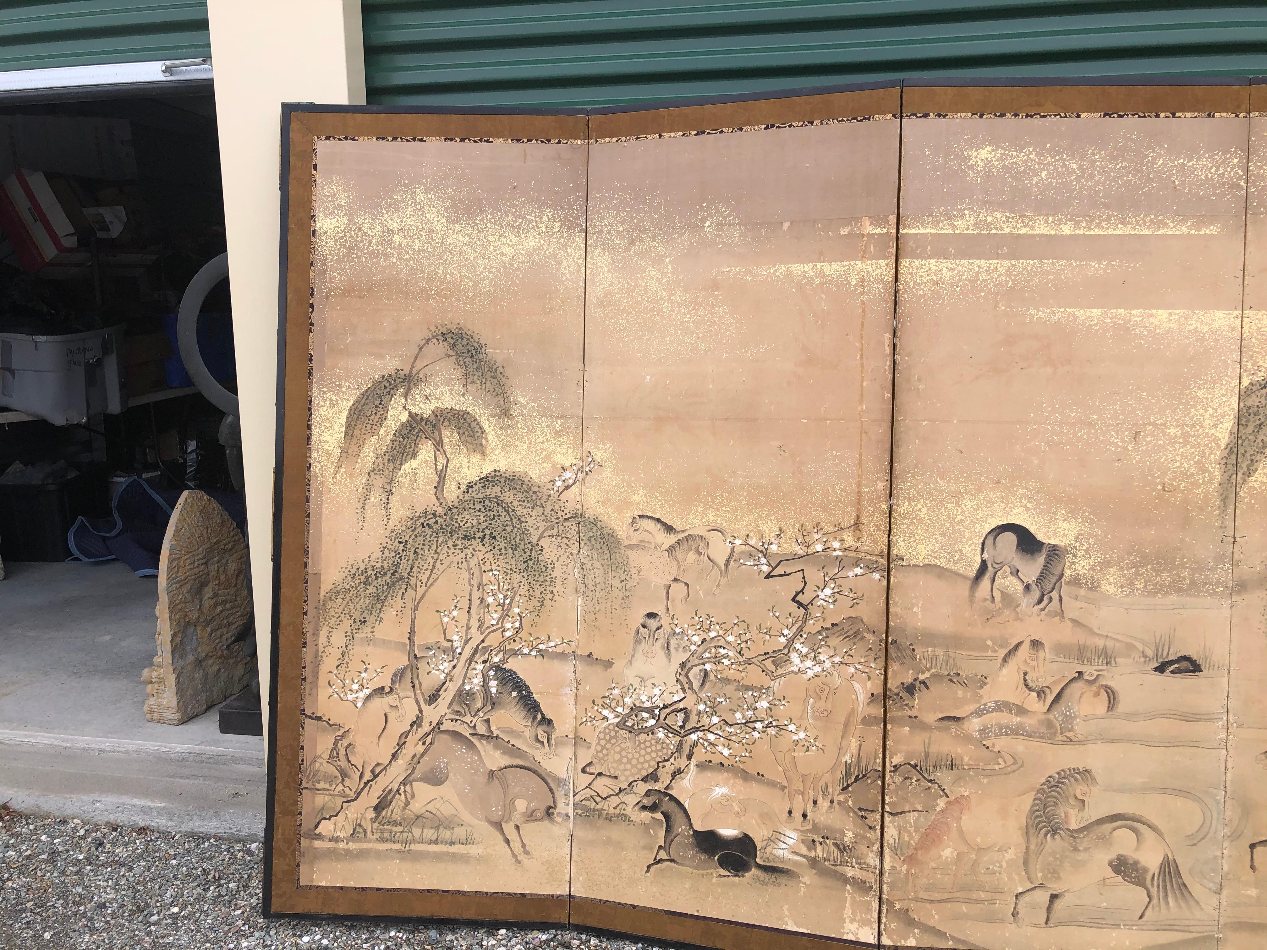 Japan, an early six-panel screen Byobu depicting 20 horses frolicking among mountains and pines. This attractive screen dates to the Edo period, circa 1850.

Horses are a scarce motif for Japanese screens and we are pleased to have found this one on