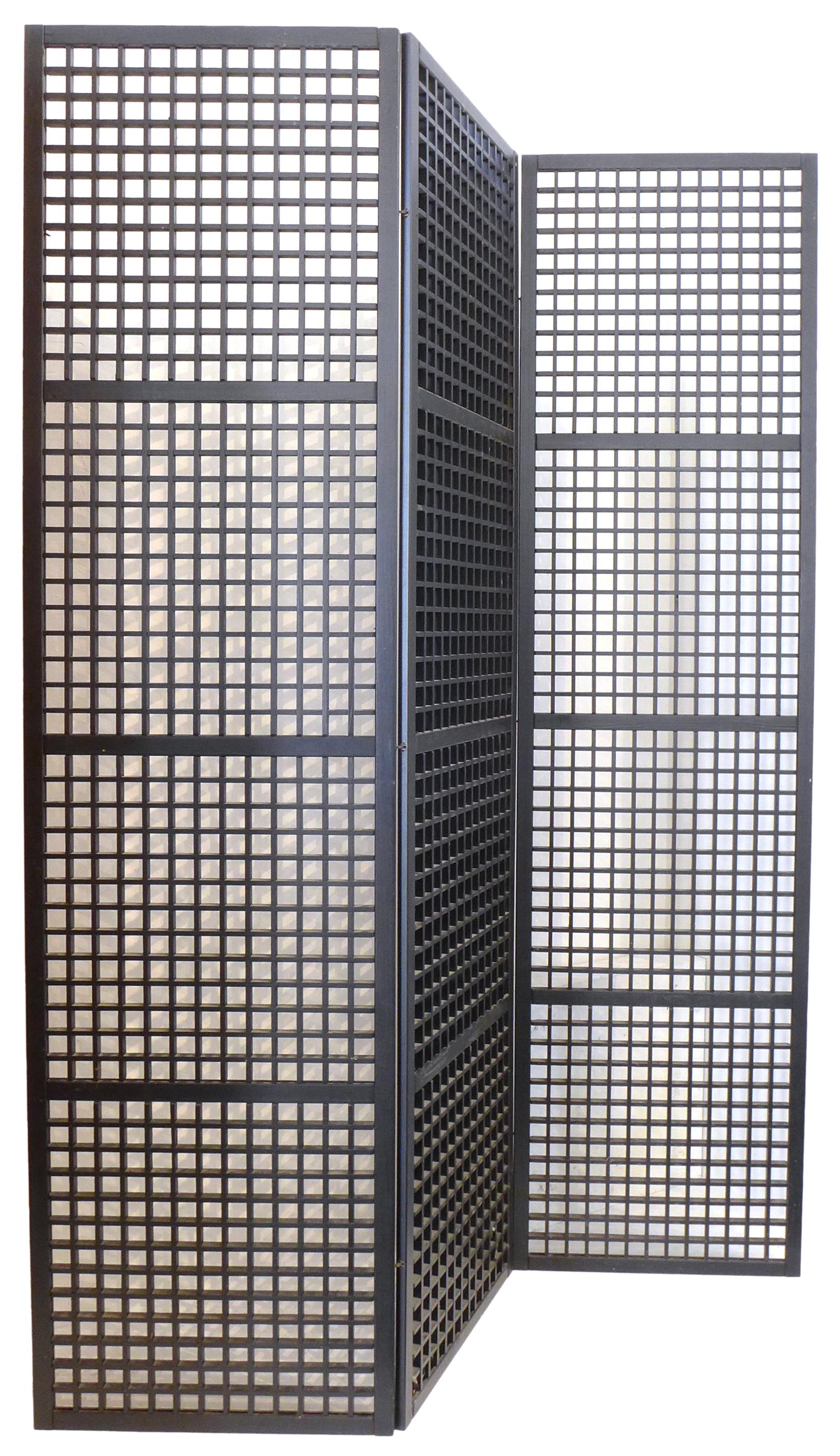 A wonderfully architectural and minimalist, Japanese lacquered, 3-panel screen/room divider. A tight grid, rectilinear cutout pattern references both the secessionist designs of Joseph Hoffman as well as the metalware designed by architect, Richard