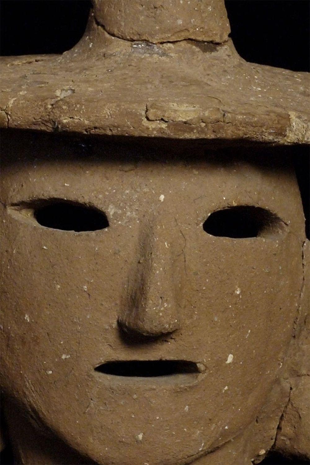 Japanese 3rd to 6thC Haniwa head. These figures kept the dead company in graveyards. Authentic ones are typically fragmentary or reassembled, as is this one. Stands 7.25 inches tall, hat diameter is approximately 5.75 inches. Most you see are