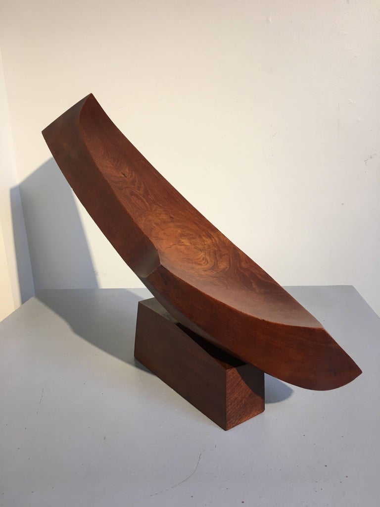 A powerful abstract expressionist caved elm wood sculpture by Japanese artist Takao Kimura, circa 1970s. Carved in two parts, the swooping, concave body plays dramatically with the oblique lines of the sides, and seems almost impossibly balanced on