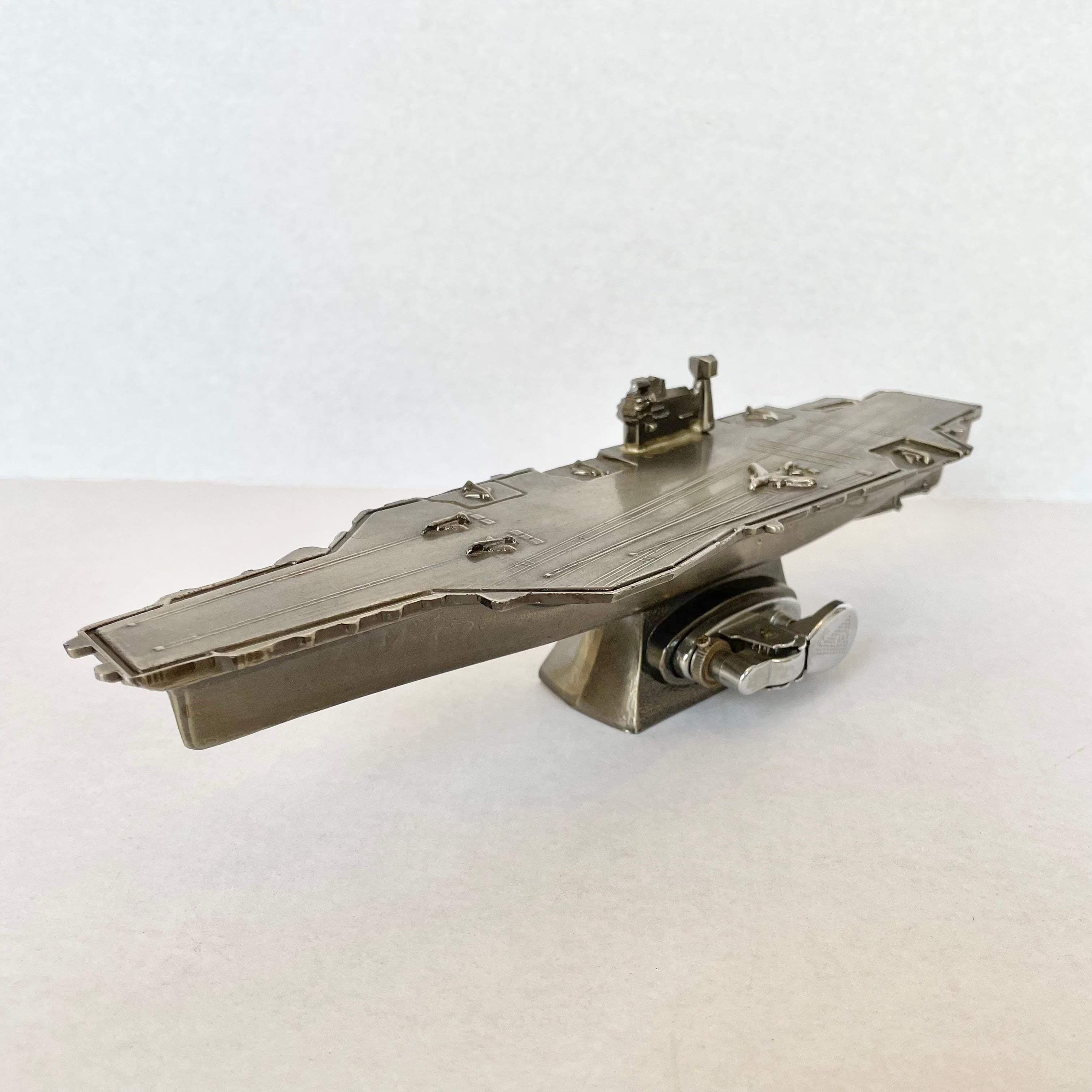Unique vintage table lighter in the shape of an aircraft carrier. Made in Japan with 