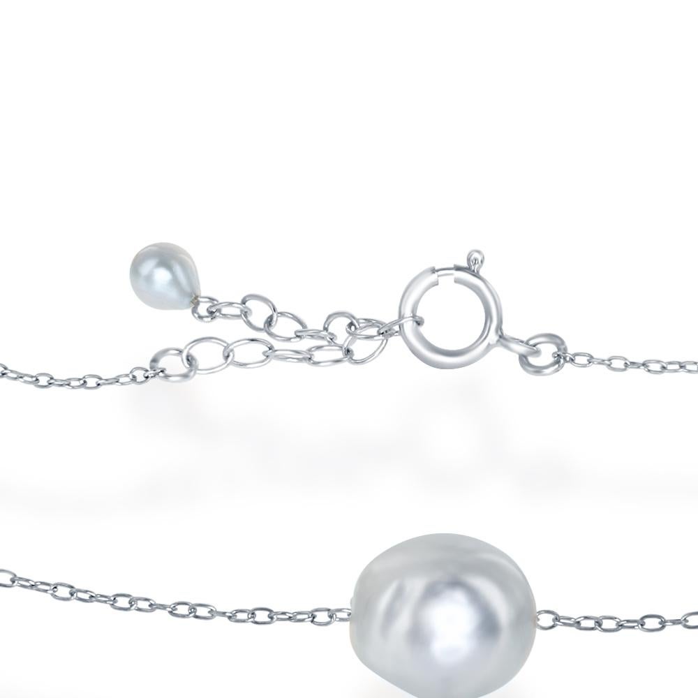 This tin-cup style bracelet features cultured Japanese Akoya natural blue baroque pearls. The pearls range in size from 6.5-9mm and are set on a sterling silver chain. The bracelet is adjustable in length between 7 and 8 inches.
