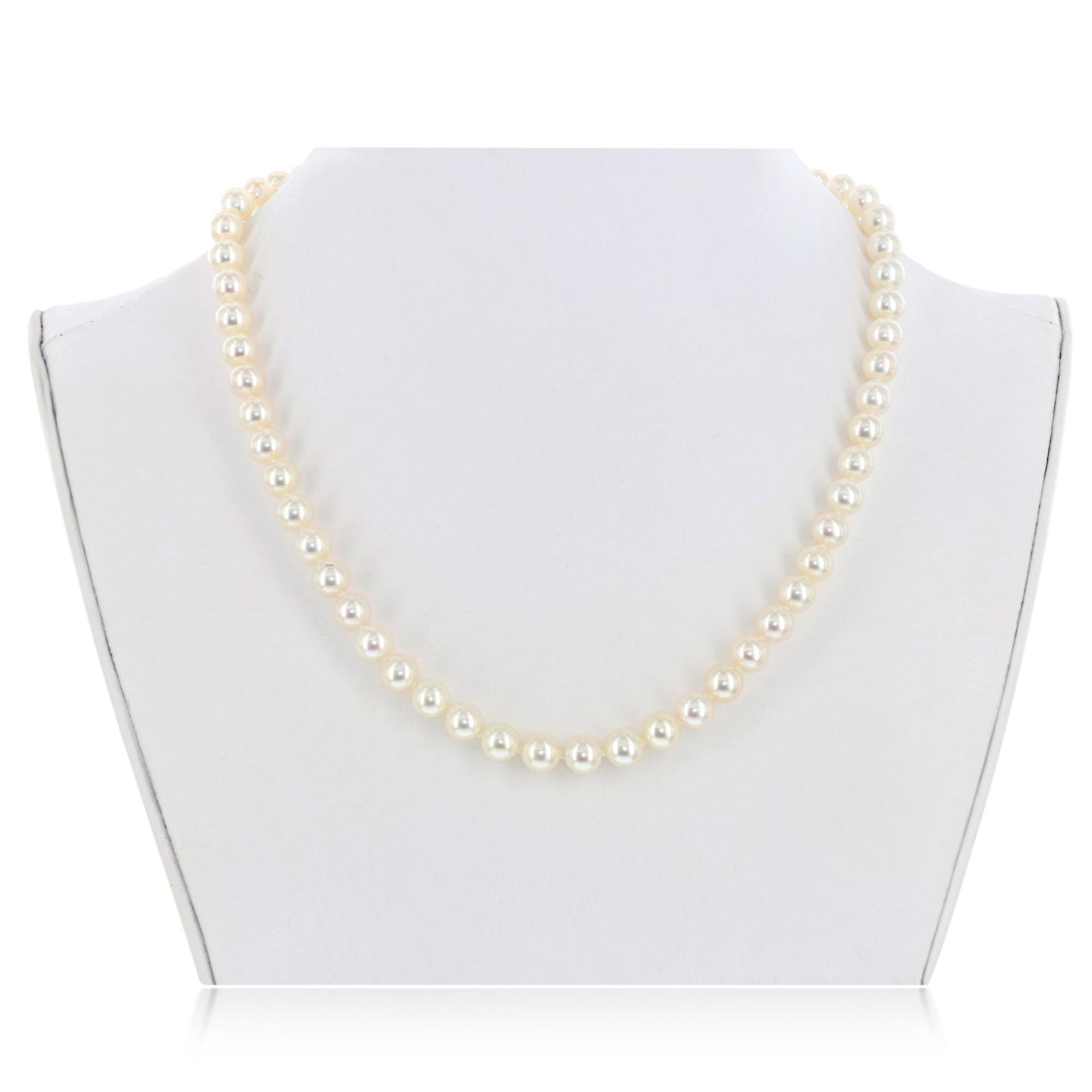 This exquisite Japanese Akoya cultured pearl necklace features distinctive, lustrous, natural color round pearls measuring 9-9.5mm. This necklace is strung with a textured 14 karat yellow gold 10mm ball clasp. 
This necklace makes the perfect