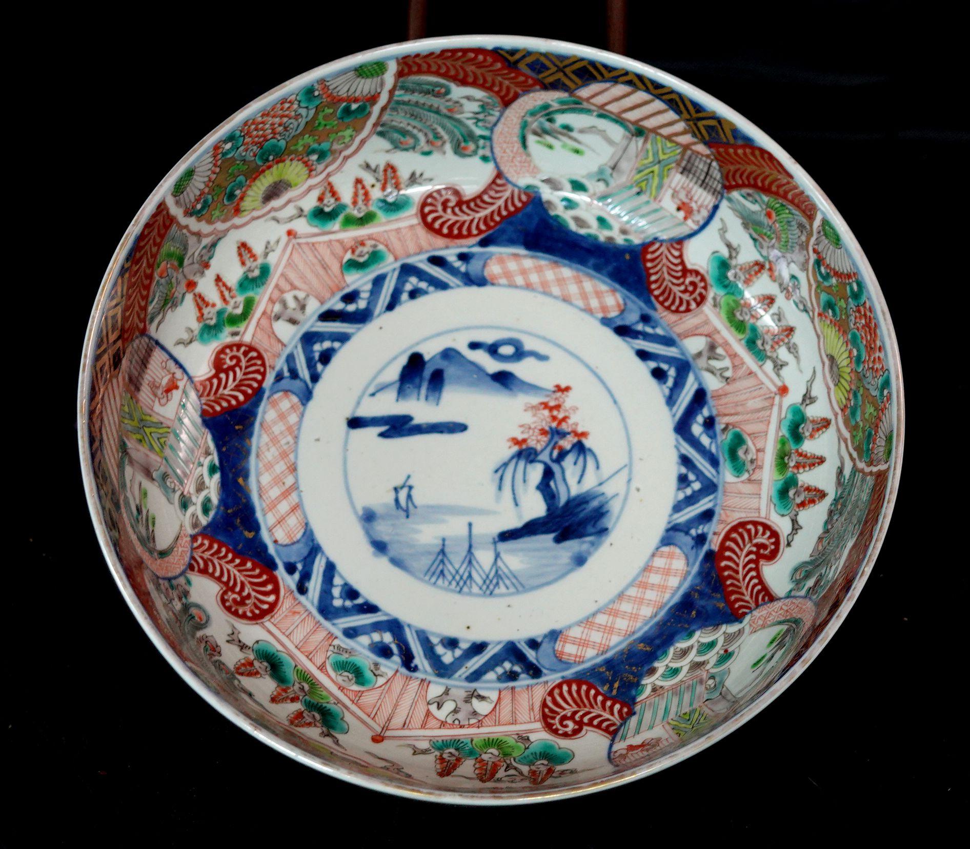Japanese antique a large 19th century Imari bowl with landscape, flowers, tree and garden sense design.