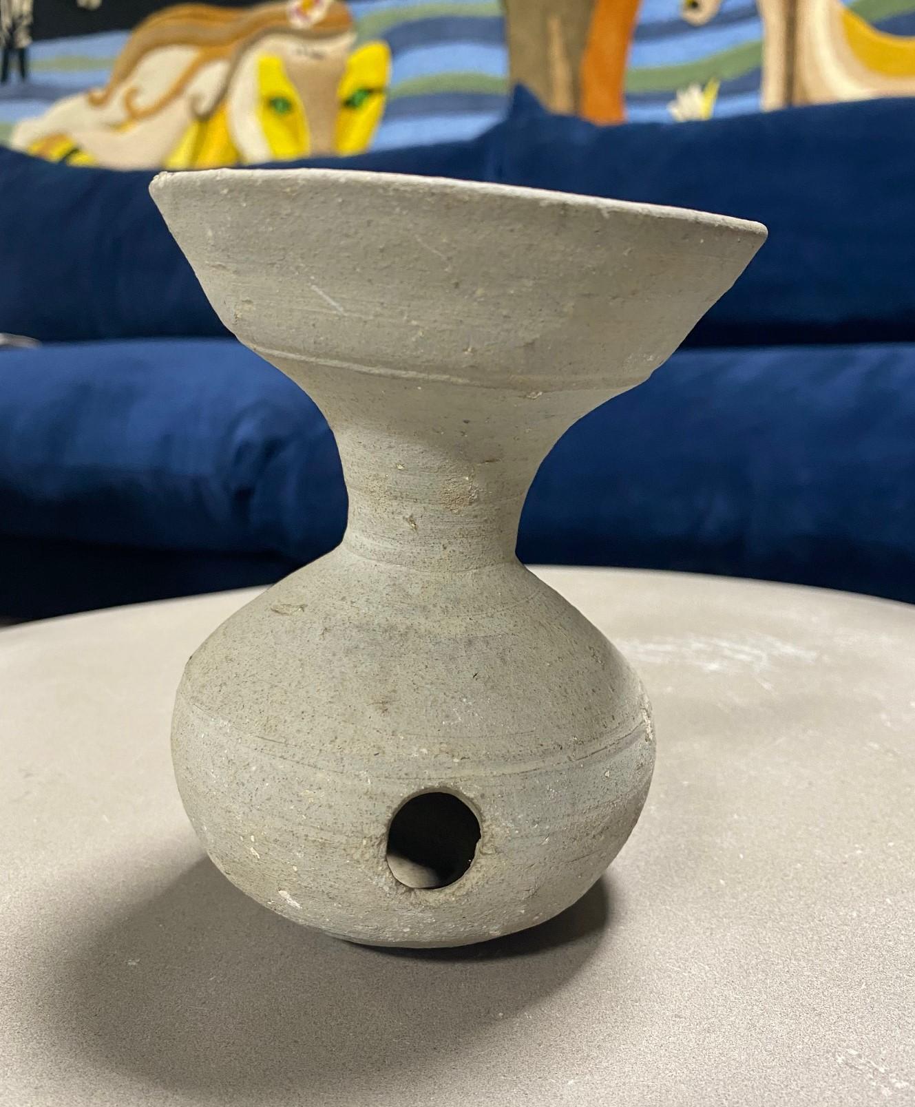A wonderful, unique, and handcrafted piece of ancient Japanese Sueki Sue ware pottery dating back to the 500-600s (6th-7th century). Sueki/ Sue pottery was a blue-gray form of stoneware pottery fired at high temperatures. It was produced in Japan