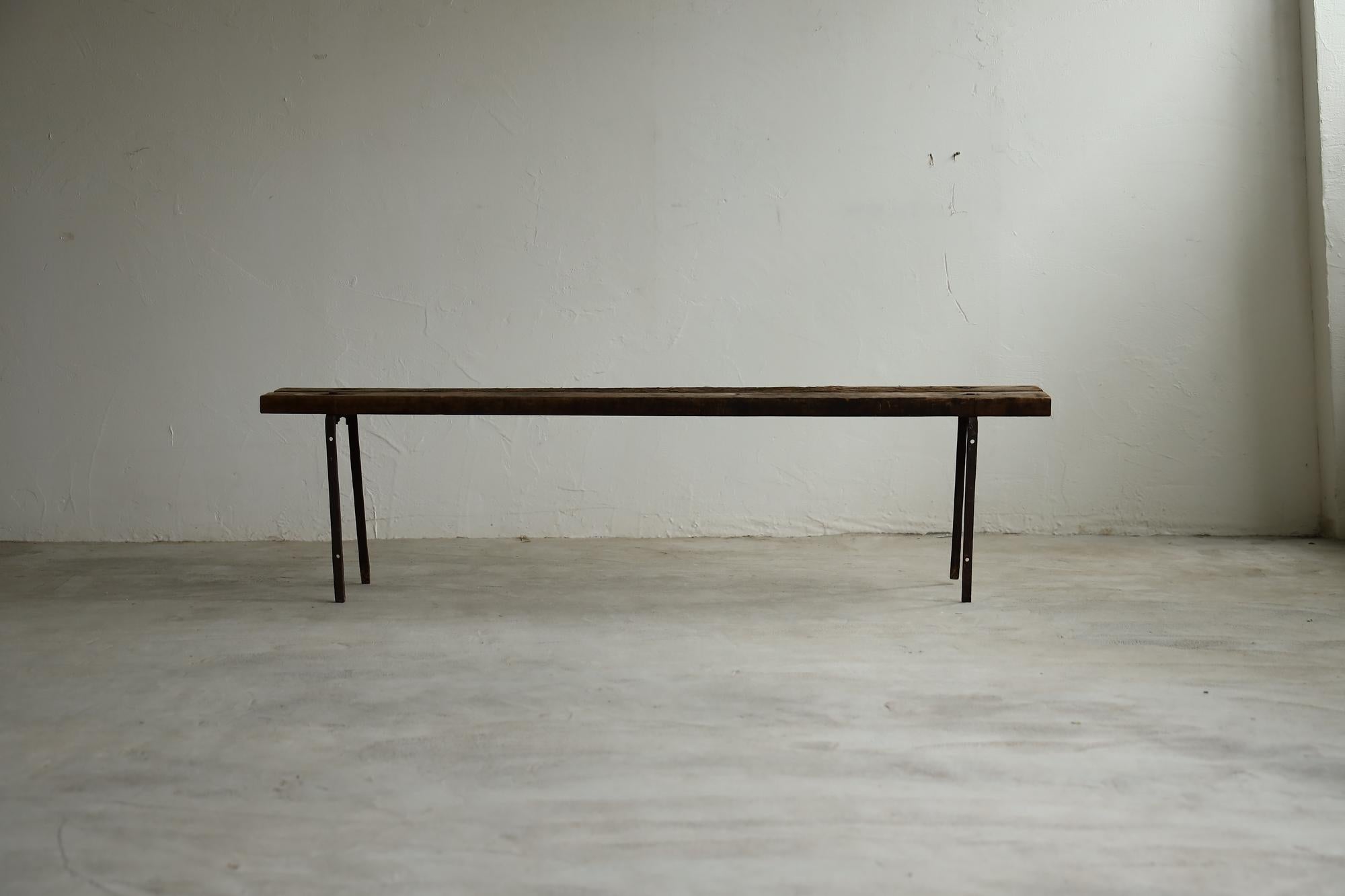 Introducing our antique Japanese bench, a remarkable piece that embodies the serene beauty of wabi-sabi. This bench allows you to appreciate the harmony of imperfection and the passage of time.

The legs are crafted from iron, and over the years,