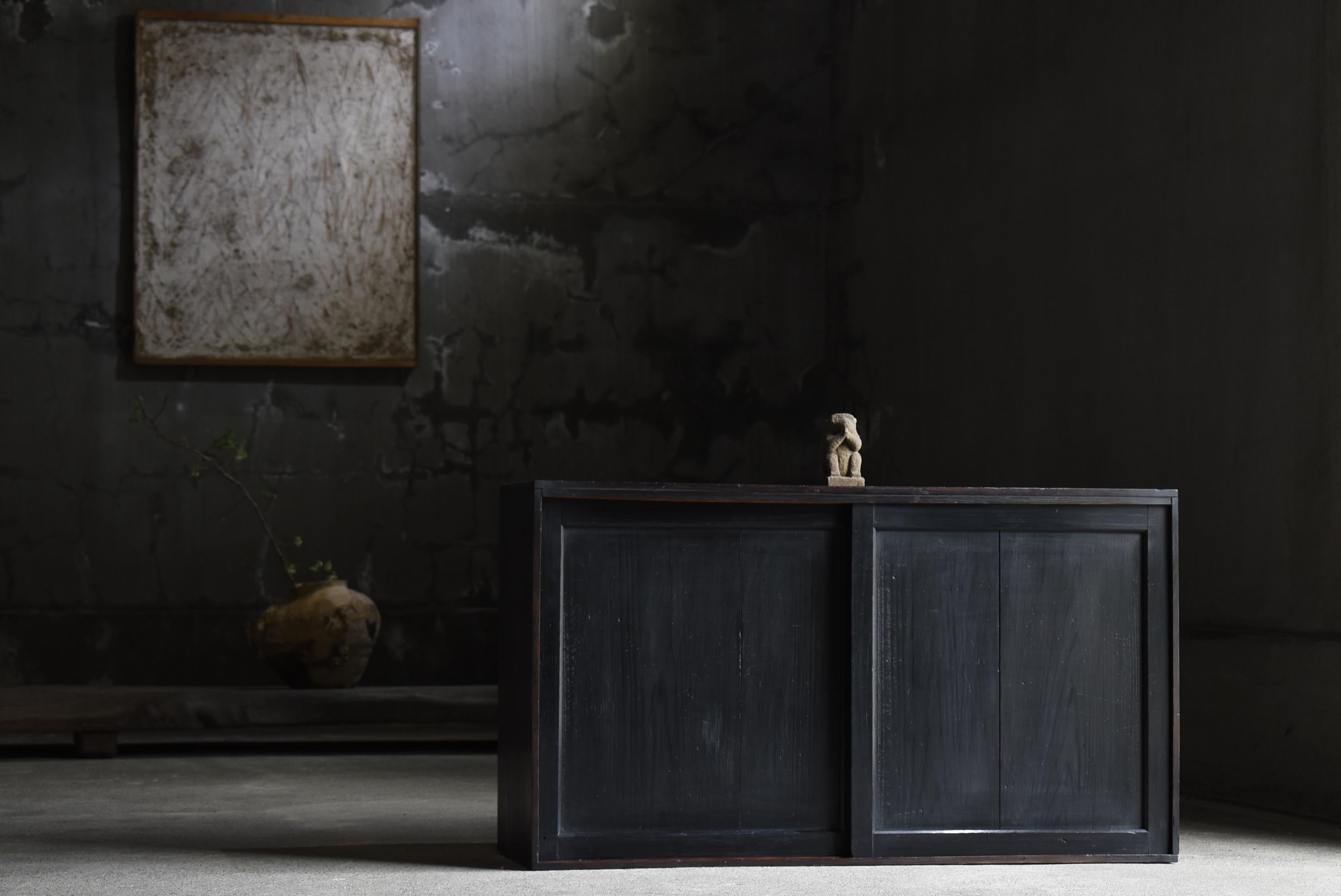 Very old Japanese black cabinet.
The furniture was made in the Meiji period (1860s-1900s).
It is made of cedar wood.

The design is simple and rustic.
There is no unnecessary design, it is the ultimate in simplicity.
Beautiful jet-black