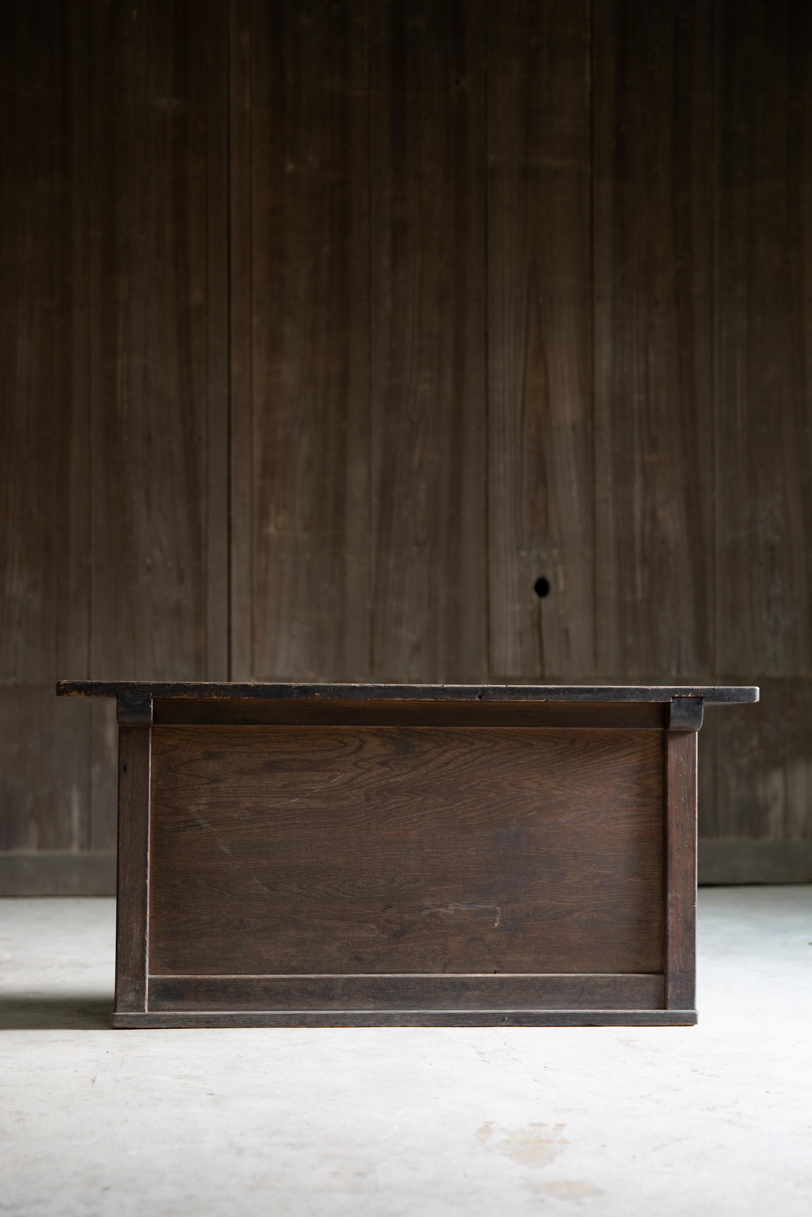 Japanese antique low display stand manufactured circa 1880s - 1910s (Mid to late Meiji period), estimate from the style, technique & conditions. Finished with traditional black Urushi lacquer.

Top panel is made of single solid wood panel, while the