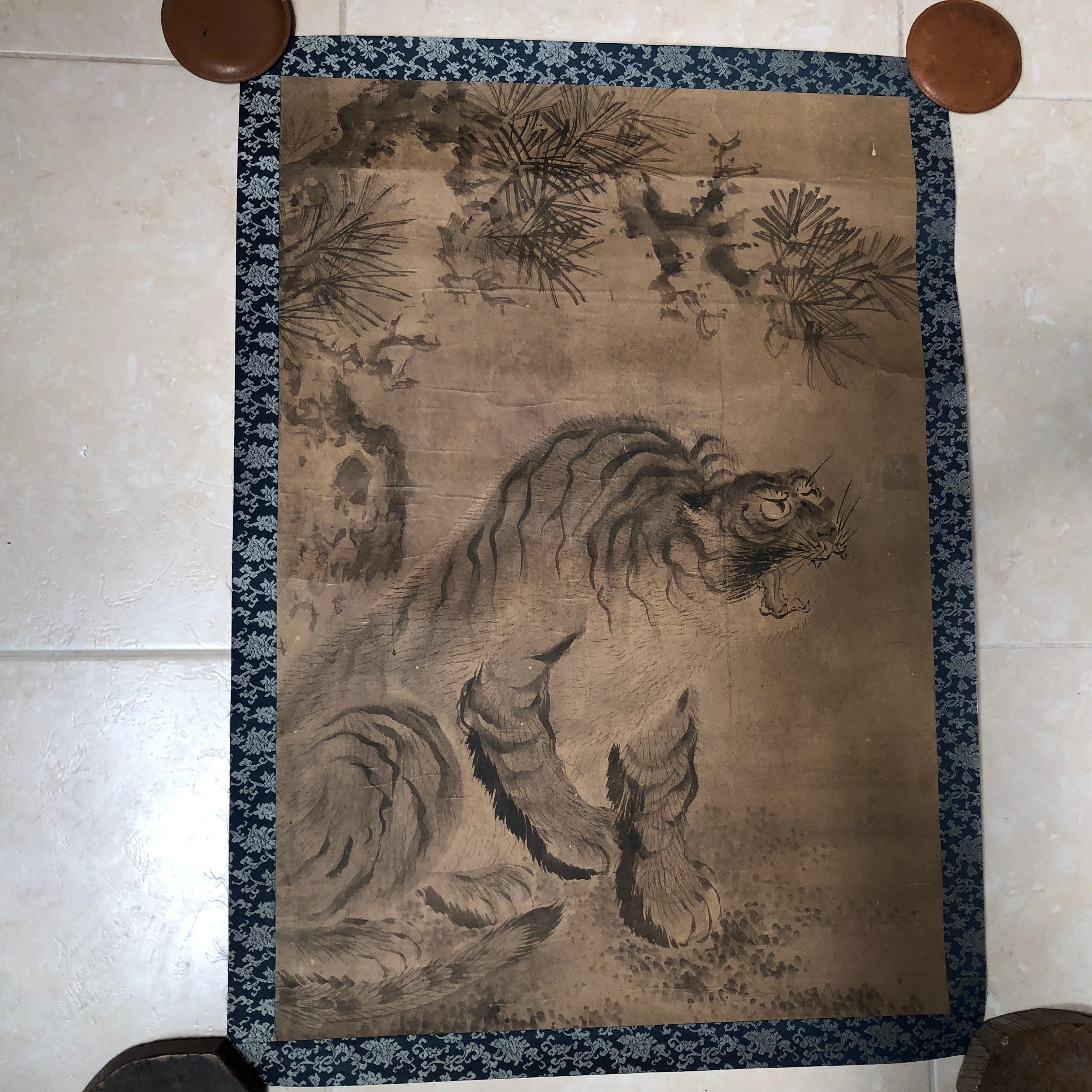 A beautiful and compelling Japanese antique hand-painted silk painting of a stealthy tiger- worthy of your favorite room.
Hand painting on silk in simple soft pleasing colors - immediately frameable. 

Remnant old signature stamp top
