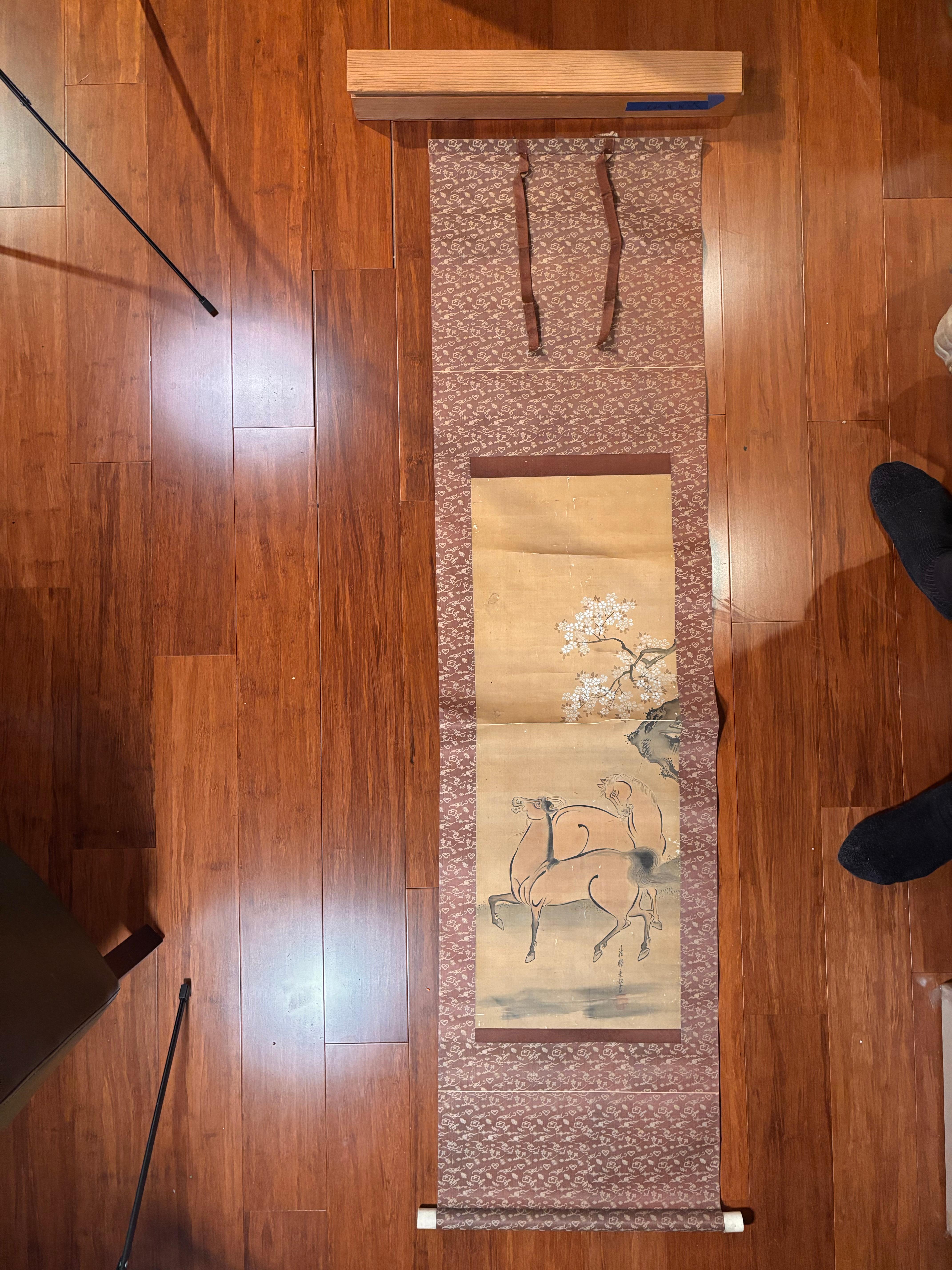 A bold, spectacular Japanese hand-brushed, hand-painted silk scroll of two horses below plumb tree mountain- worthy of your favorite room
Hand painting on silk in simple soft pleasing colors, signed.

Length is 65 inches and width with rollers is