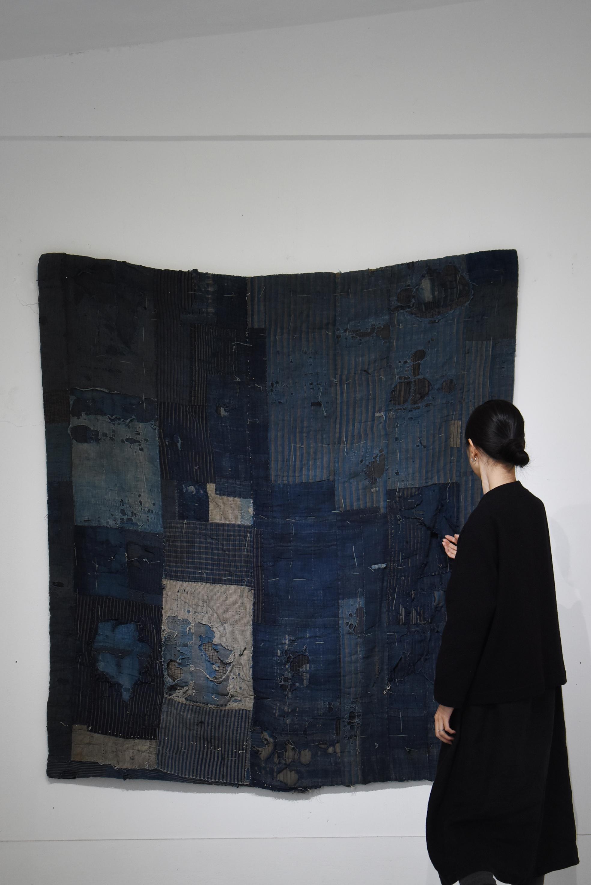 This is an old Japanese BORO textile, dating back to the Edo period (1800s–1860s). It is a rare cloth that has survived through a long span of time. The interplay of indigo and natural white—layered, patched, and worn through generations—is far more