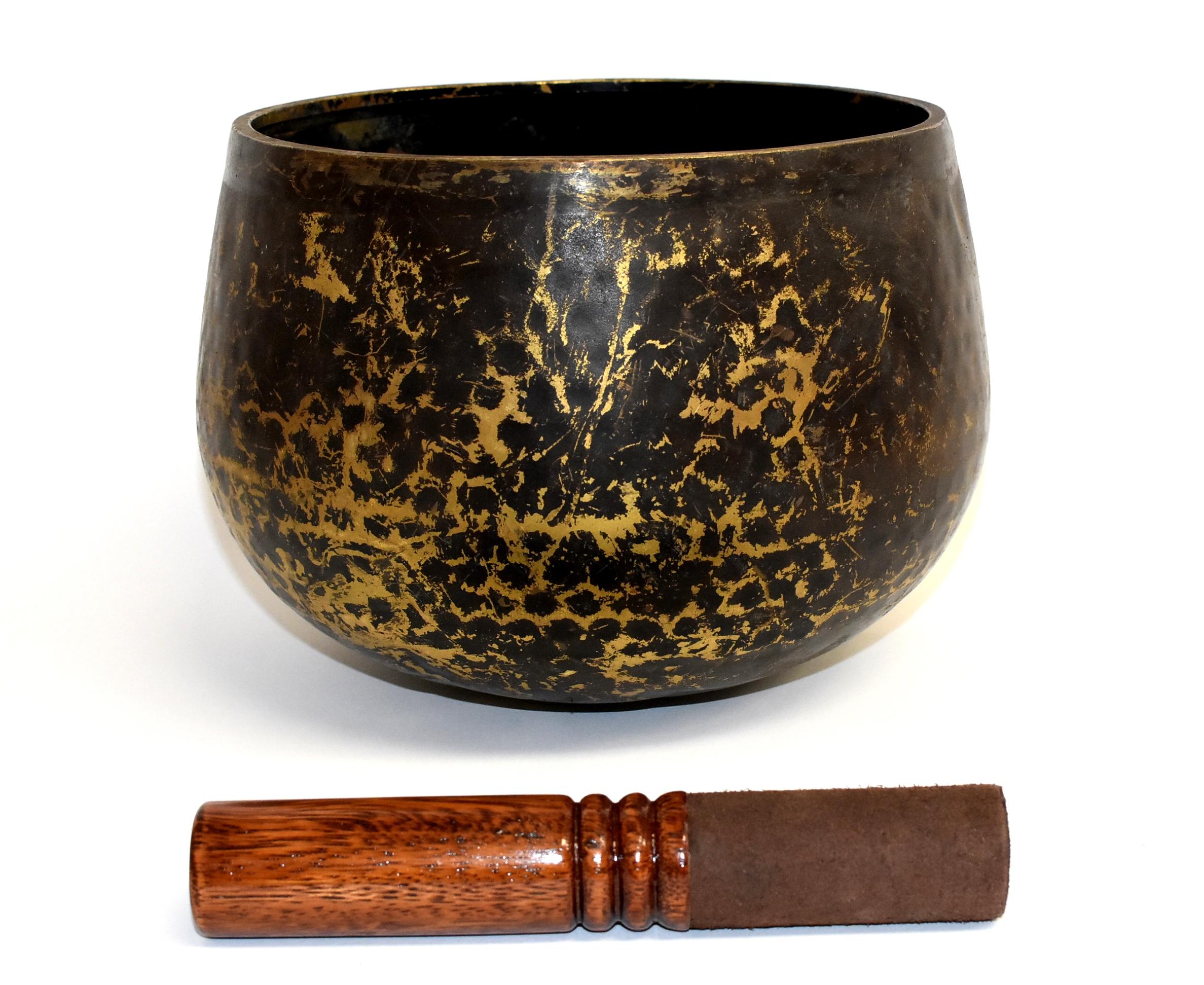 A large, substantial, handmade singing bowl made of solid bronze with hand-hammered beehive pattern. This bowl makes a beautiful, enlightening sound that is at once soothing and thought provoking. Such a bowl was used in the Japanese temple to sync