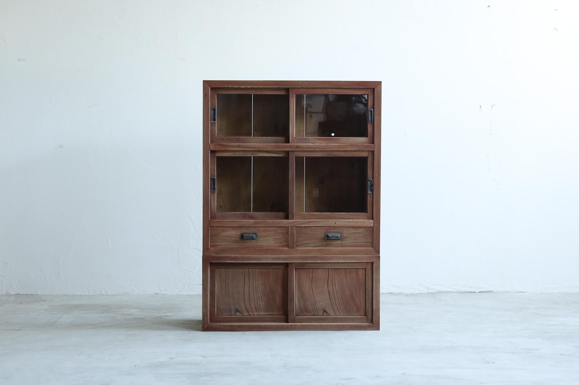 This Japanese antique cabinet was made in the Taisho period (1912-1926).

This furniture was made with the same tradition and advanced techniques as Japanese shrines.
In Japan, it was called a tansu (chest of drawers) and used to store