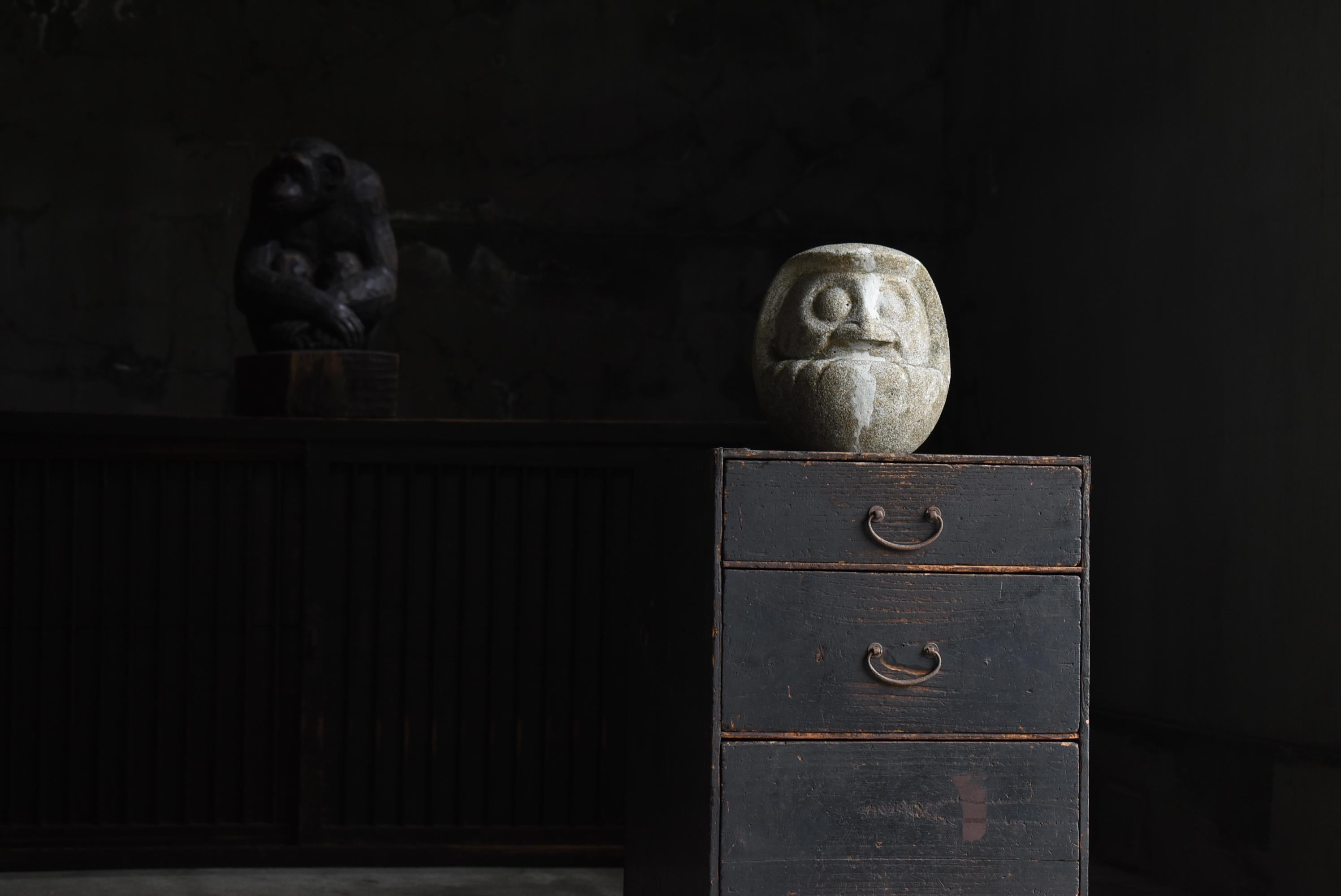 This is a very old cement Daruma doll made in Japan.
It was made during the Meiji period (1860s-1920s).

Wooden Daruma dolls are often found, but cement ones are rare.
A cement mold of Daruma doll.
Many Daruma dolls were mass-produced using this