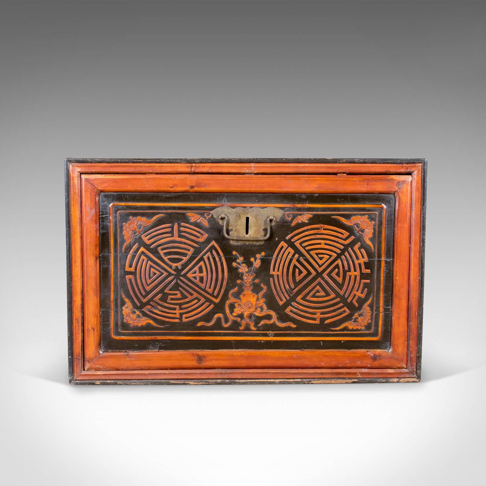 This is a Japanese antique chest, a lacquered pine trunk or blanket box dating to the late 19th century, circa 1900.

A fine example displaying good colour and finish
The front, locking panel displaying geometric form 
Side panels decorated with